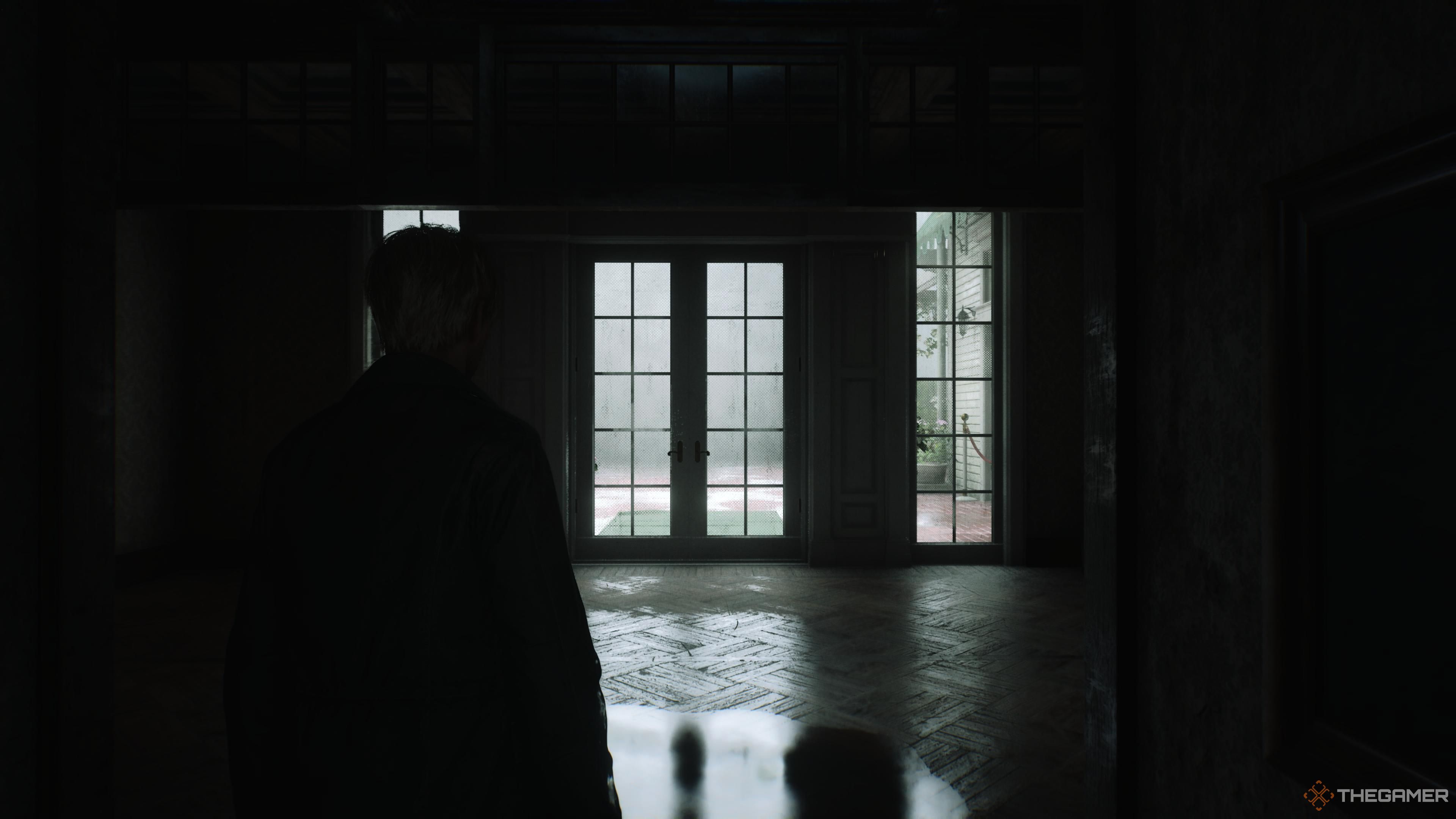a hallway in the lakeview hotel shaded in darkness in silent hill 2 remake.