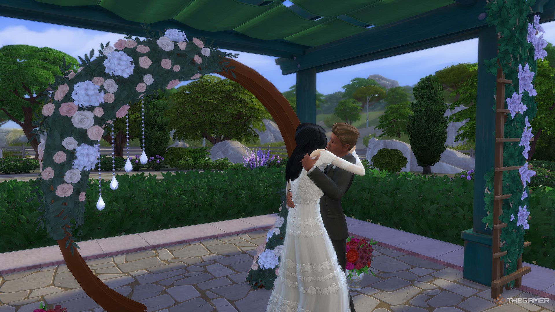 Sims kissing at the wedding arch in Tartosa in The Sims 4.