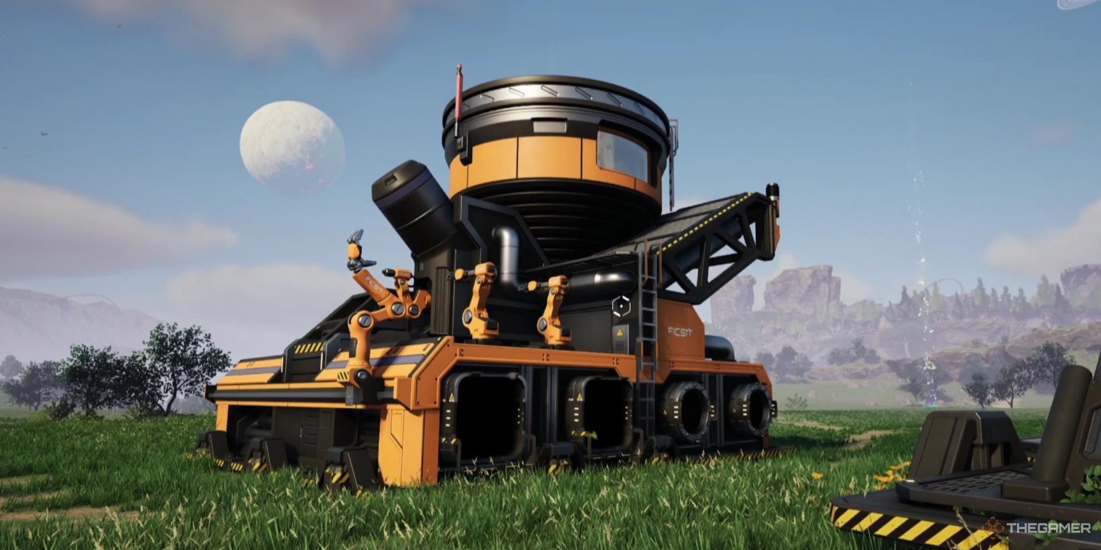 The Blender stands in the middle of a field in Satisfactory.