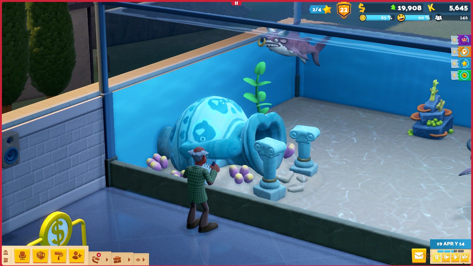 a professor observes a buill shark in an aquarium in two point museum.