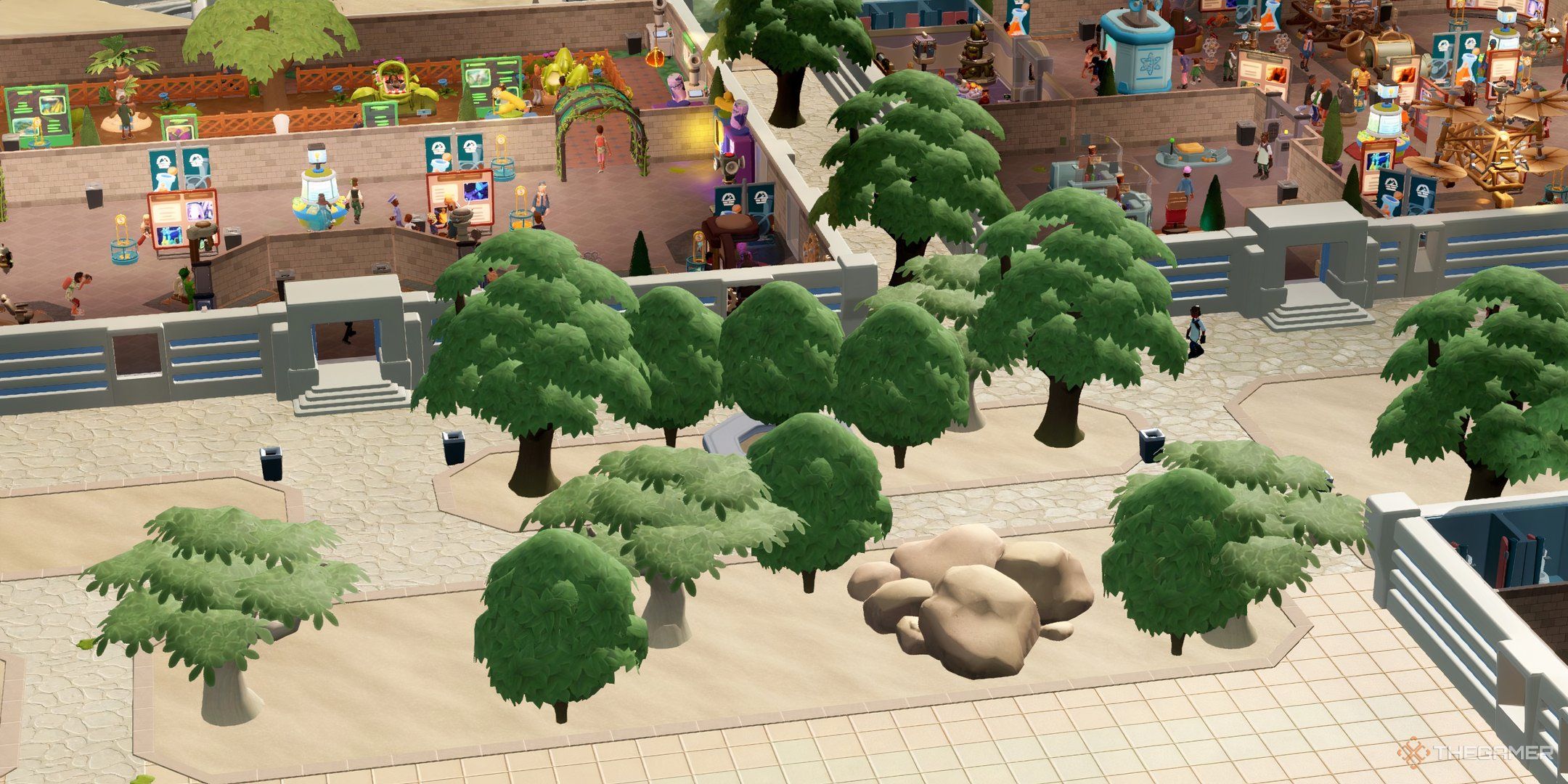 Close up view of a garden-like area in Bungle Wasteland with lots of trees and a large rock in Two Point Museum.