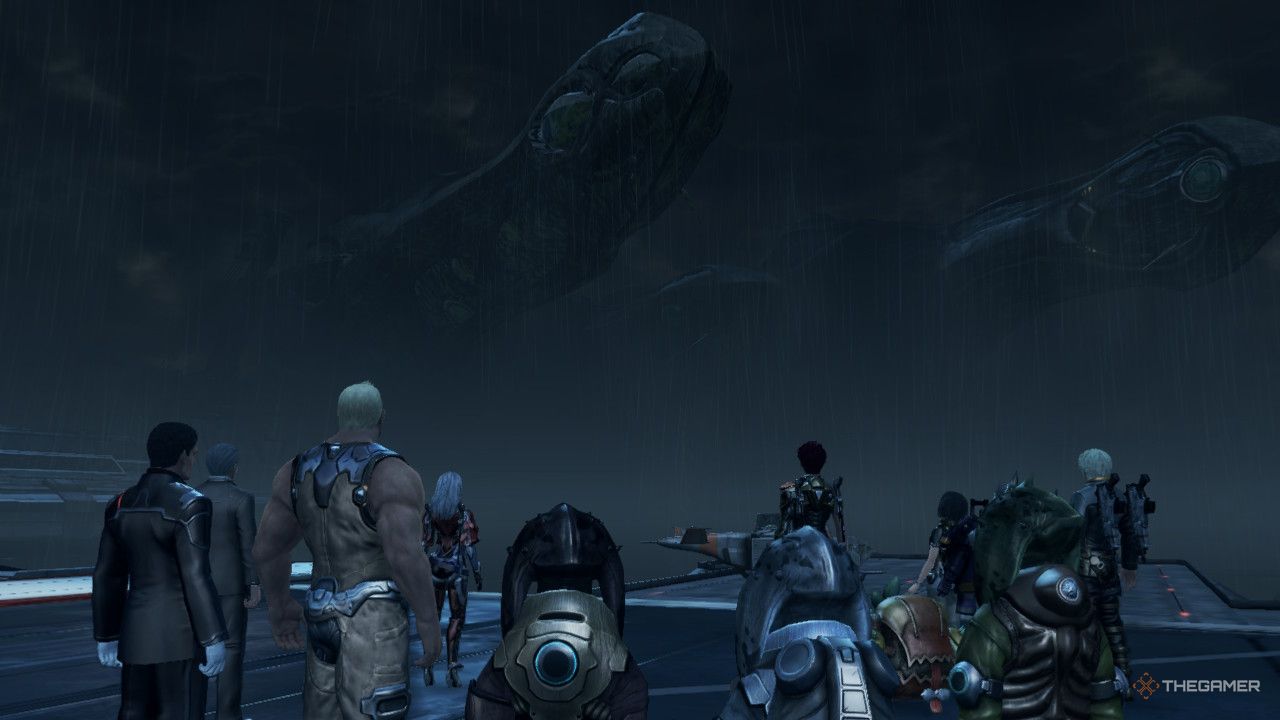 A large group of characters looking a the raining sky in the city in xenoblade chronicles x definitive edition.