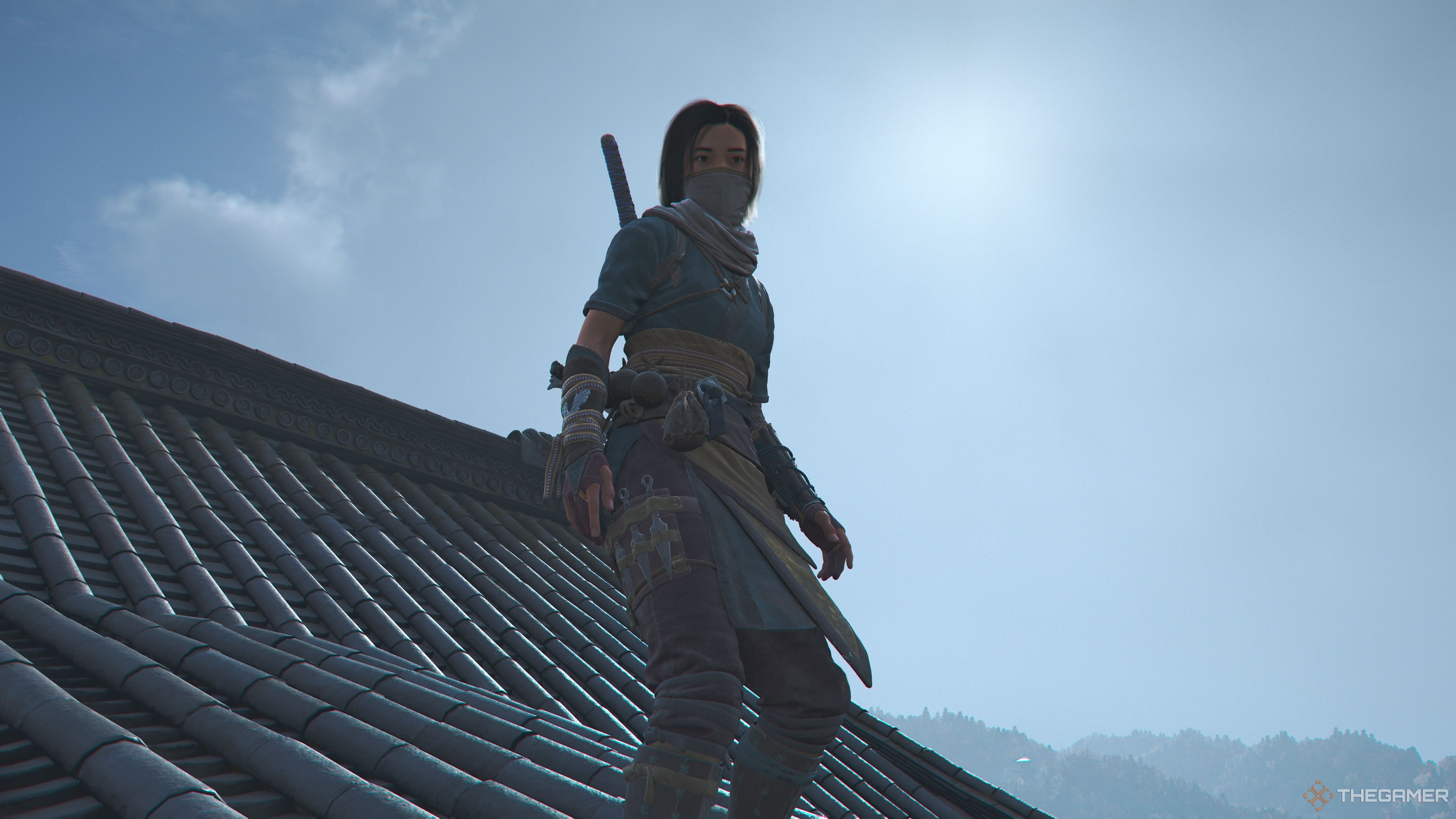 Naoe standing on a rooftop in Assassin's Creed Shadows.
