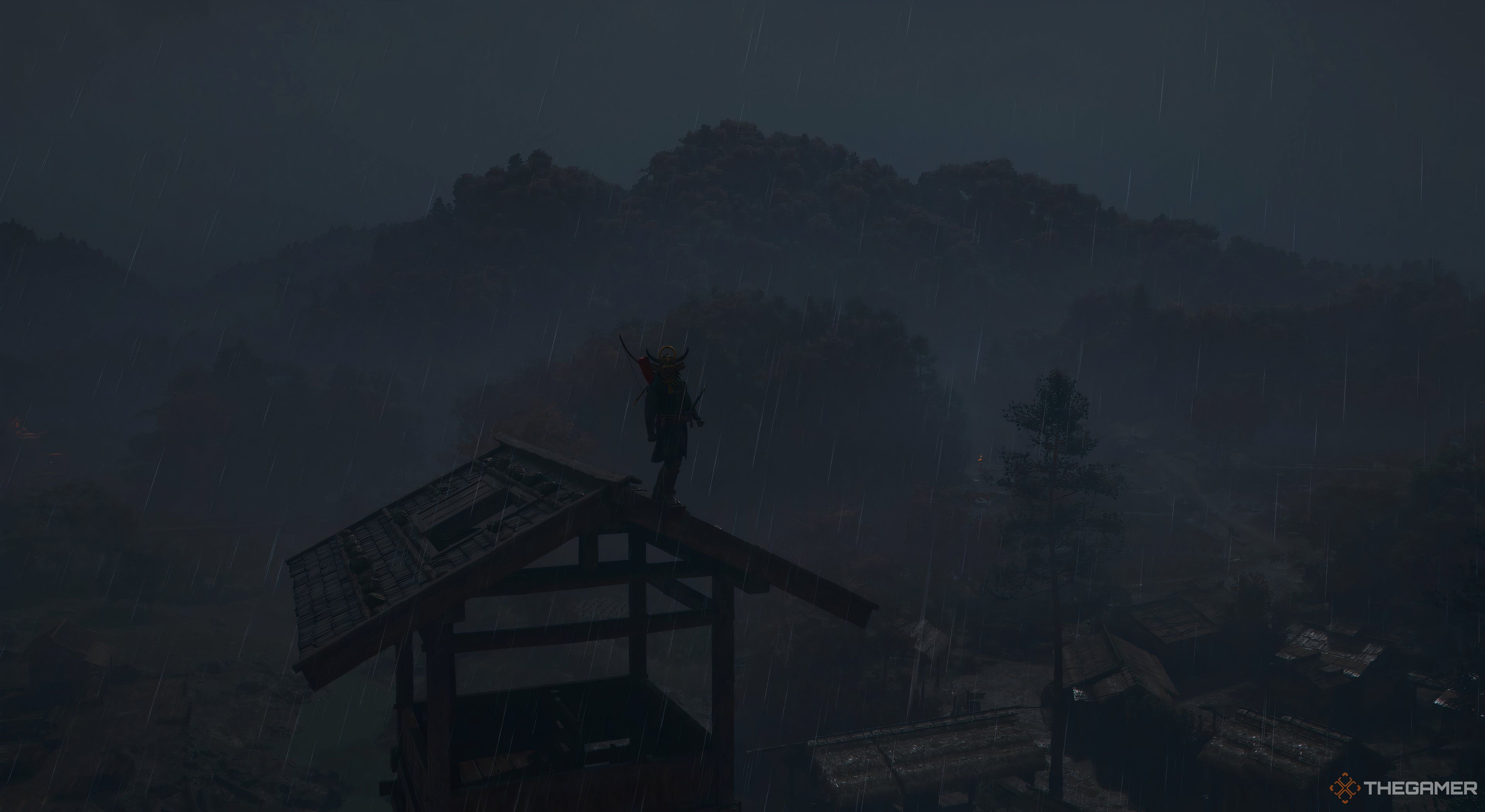 Assassins Creed Shadows Yaskue on a viewpoint in the rain. There are trees around him.