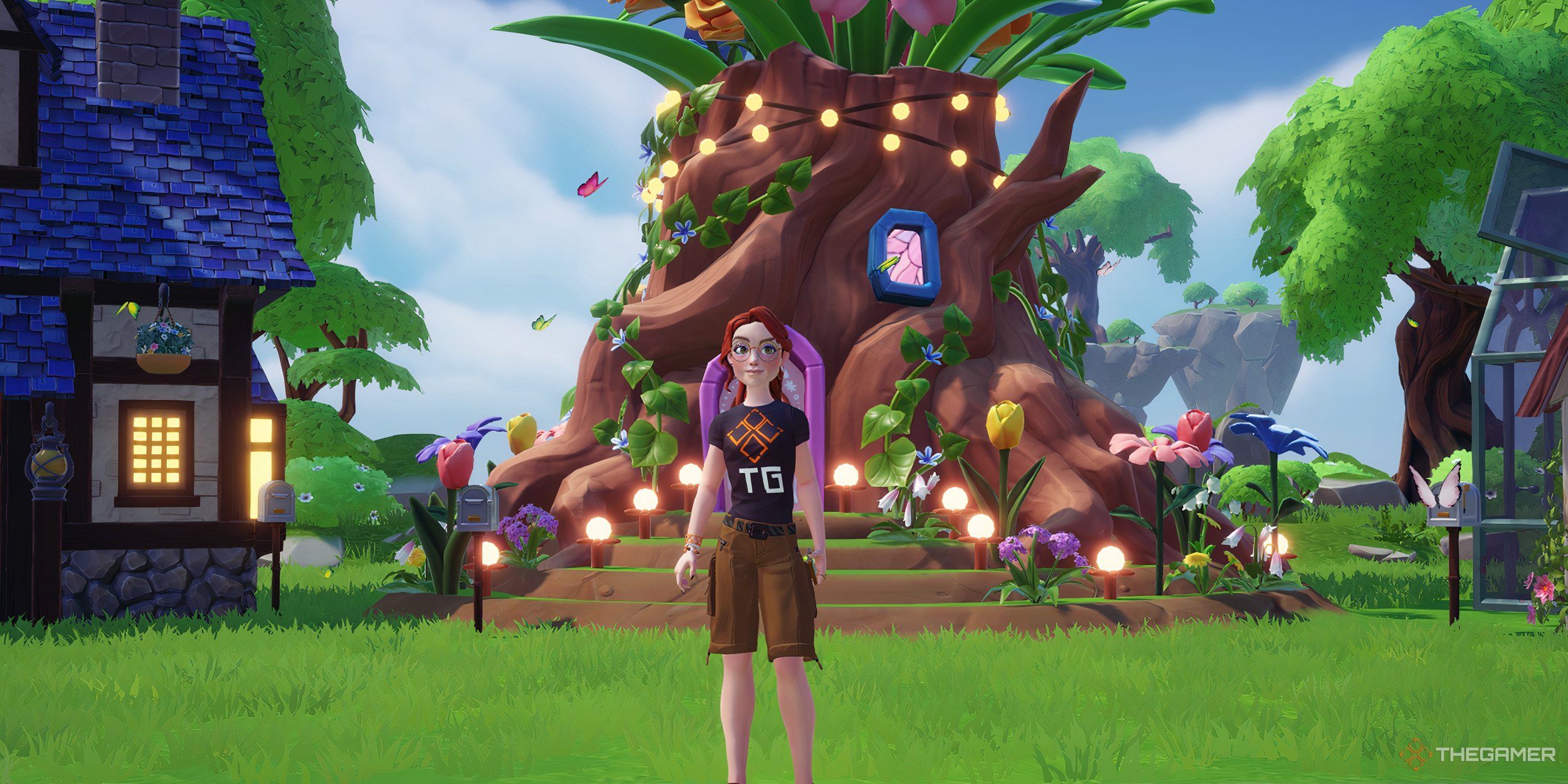 An avatar in a TG shirt standing in front of several houses
