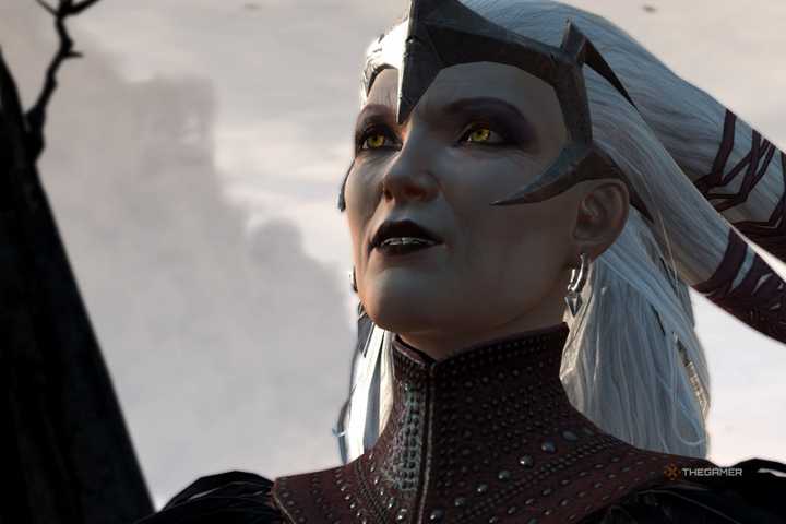 Flemeth - a witch with white hair, dark makeup, and yellow eyes - in Dragon Age 2