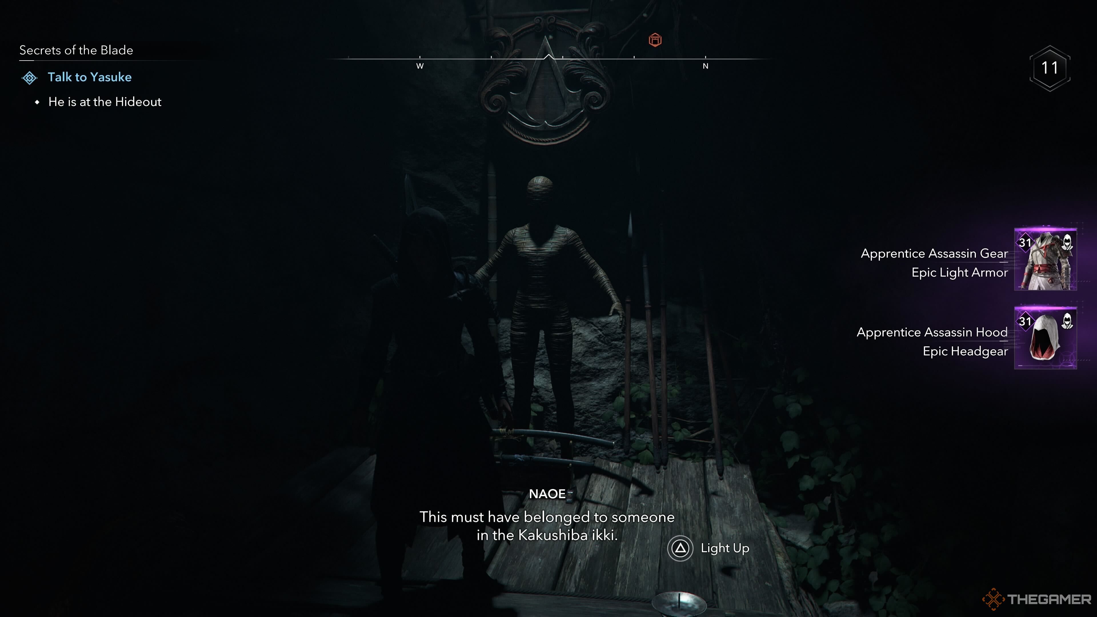 Naoe looking at the Apprentice Assassin armour in Assassin's Creed Shadows.