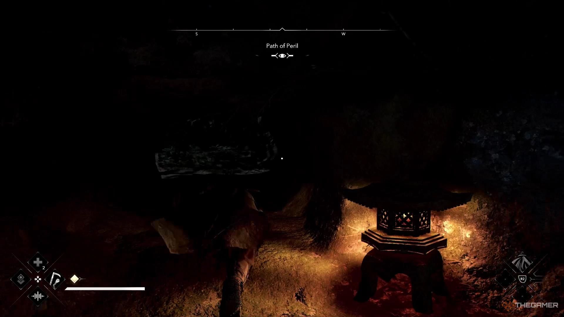 Naoe crawls through a small gap in Assassin's Creed Shadows.