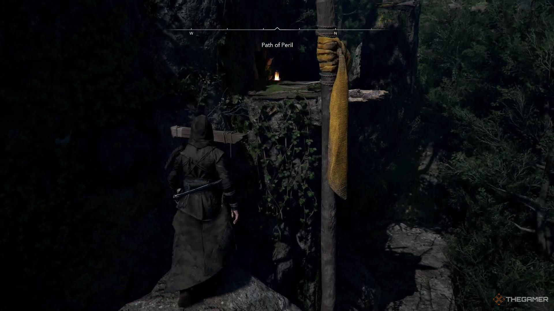 Naoe looks at a pole sticking out of a rock in Assassin's Creed Shadows.