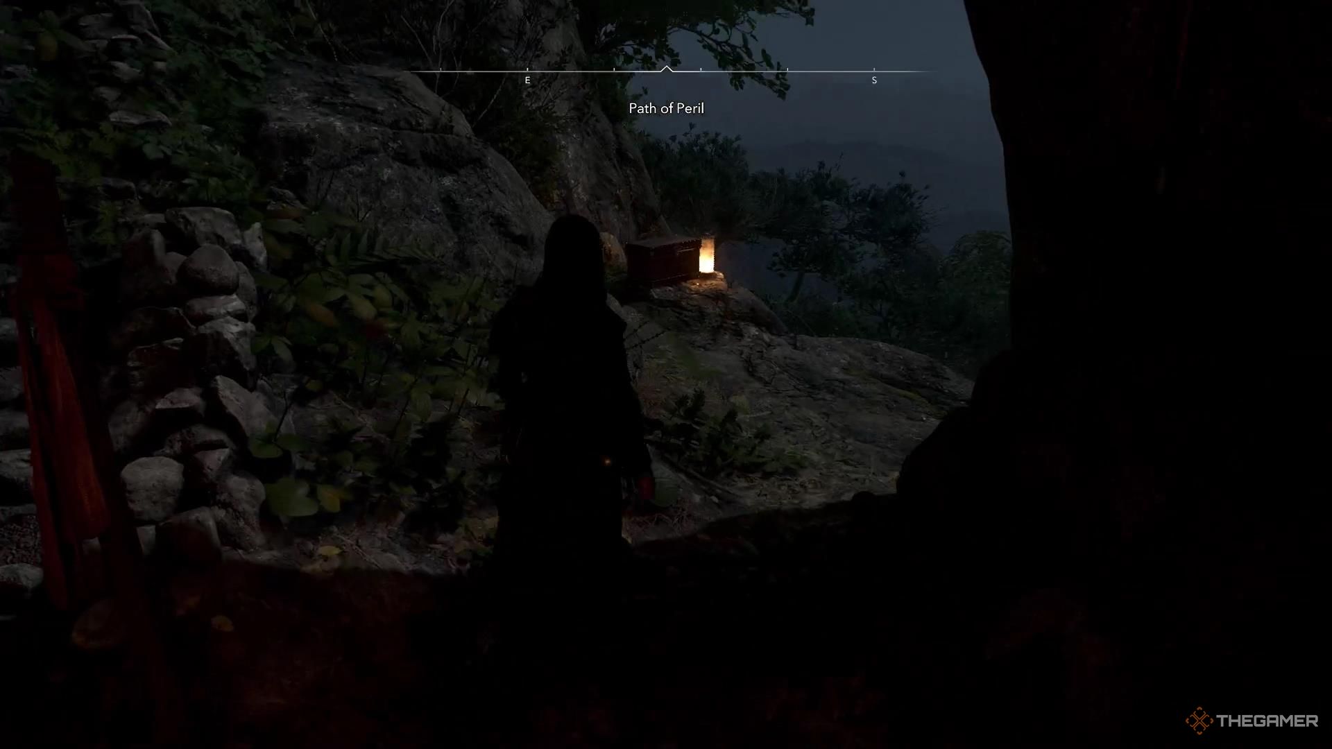 Naoe walks toward a chest on the edge of a cliff in Assassin's Creed Shadows.