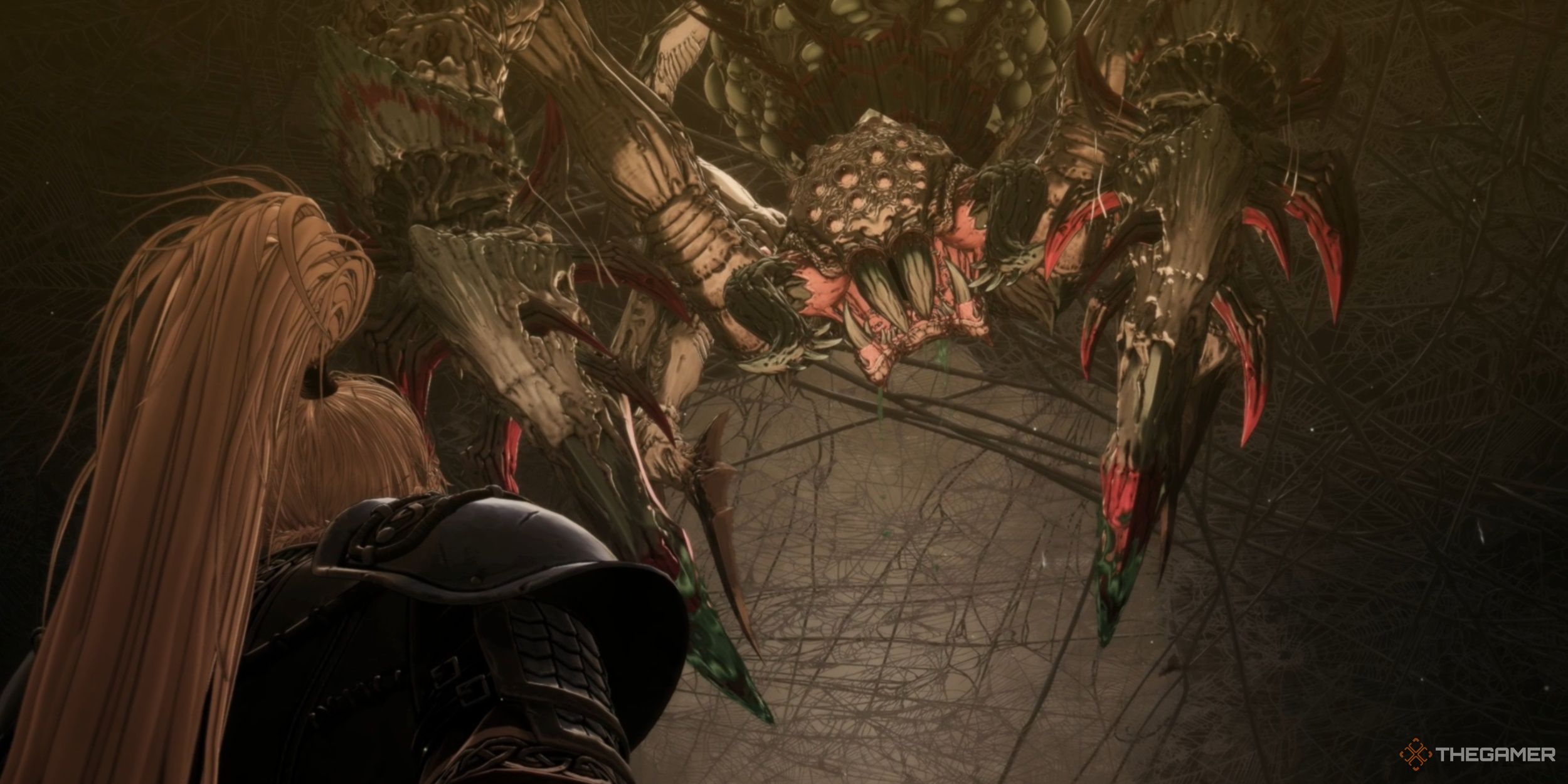 Aratra, an enormous Spider, dropping down in front of Khazan deep within the Skaffa Cave in The First Berserker: Khazan.