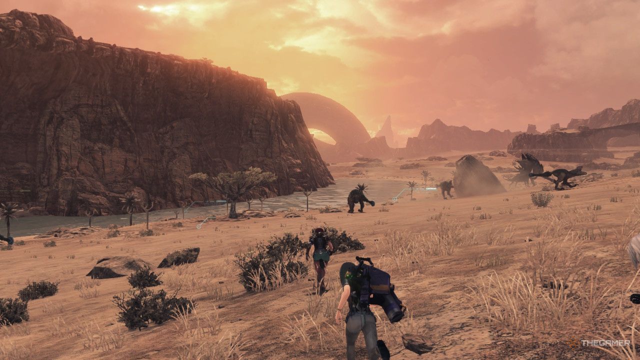 The party running towards the leaning ring during sunset in oblivia in xenoblade chronicles x definitive edition.