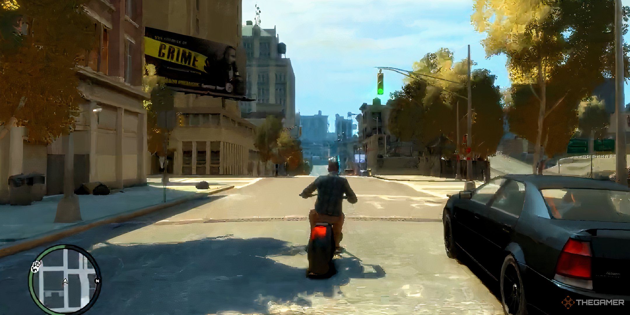 A gameplay screenshot of Grand Theft Auto 4, showing Niko riding a motorcycle in Alderney City.