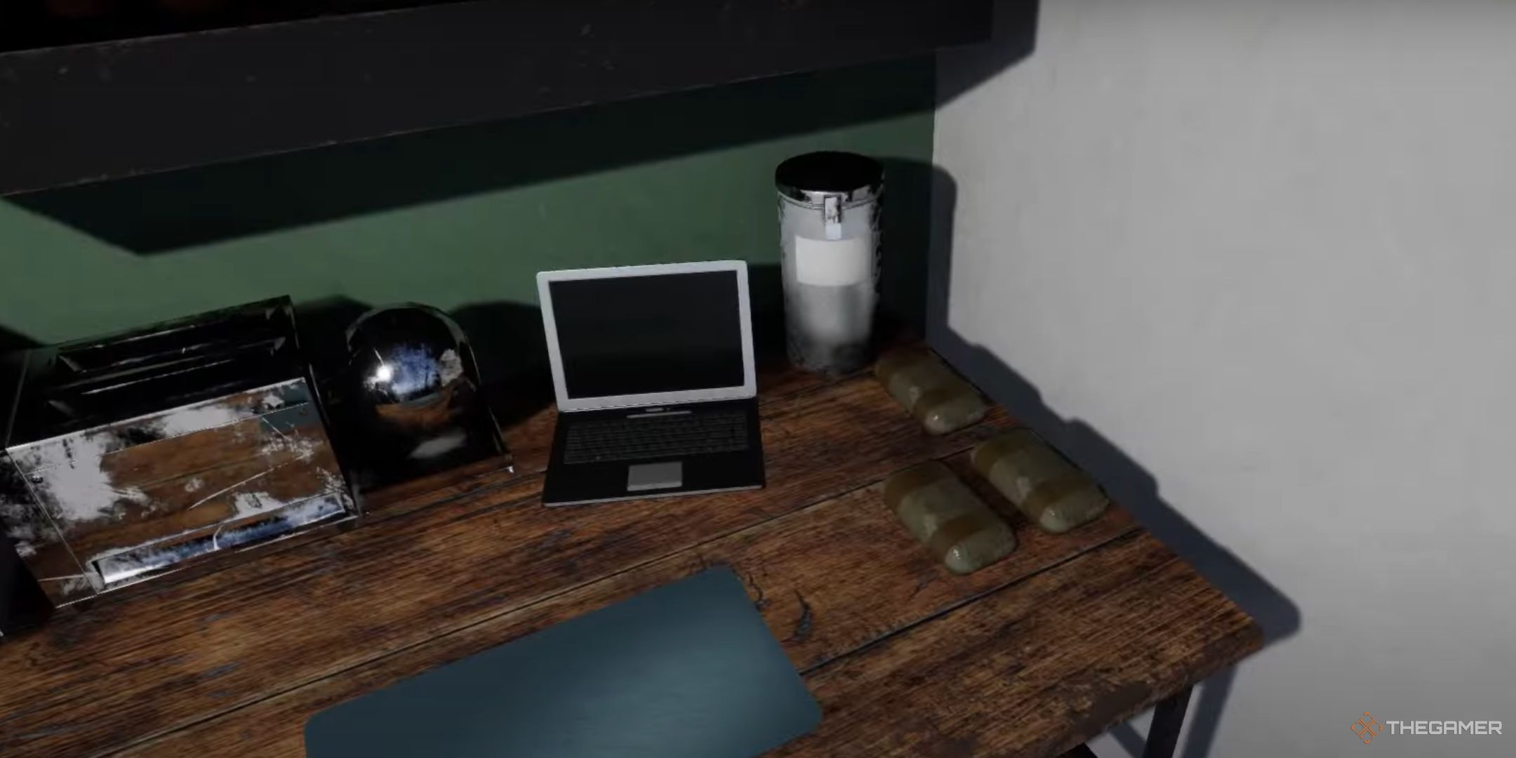 A desk with a laptop and drugs is shown in Drug Dealer Simulator.
