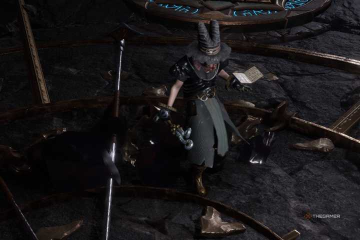 A Warlock holding a wand and spell tome in Last Epoch.