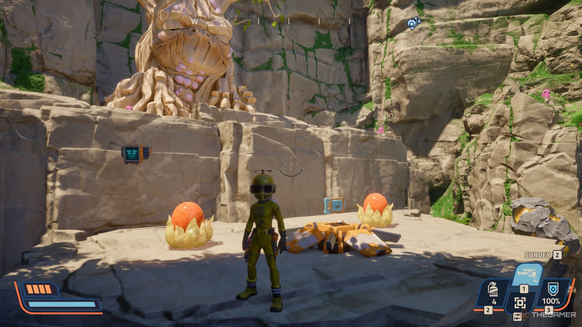 A pioneer in the Crash Test suit near a supply crate and two orange goos in Revenge of the Savage Planet