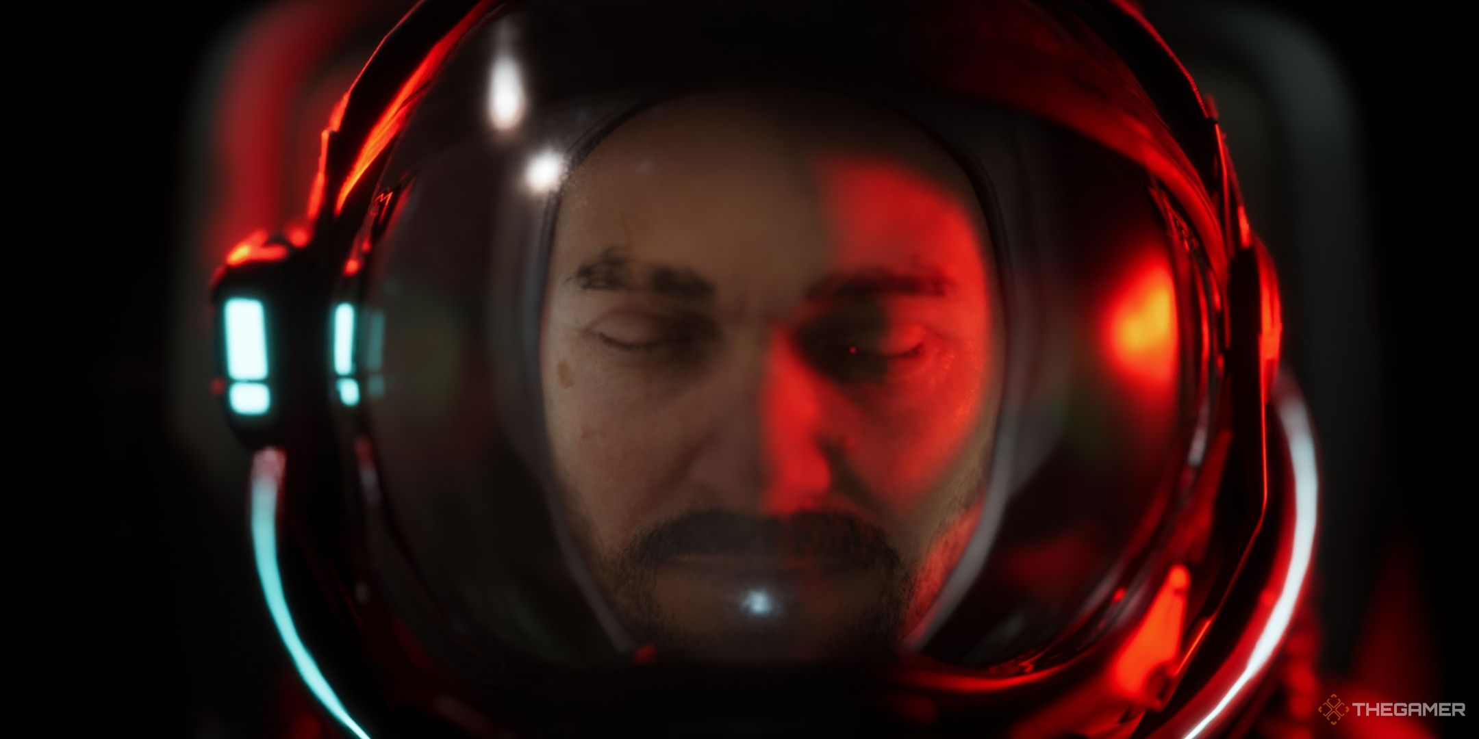 an extreme closeup of jan dolski in his space suit with the red glow of an emergency light in the opening sequence of the alters.