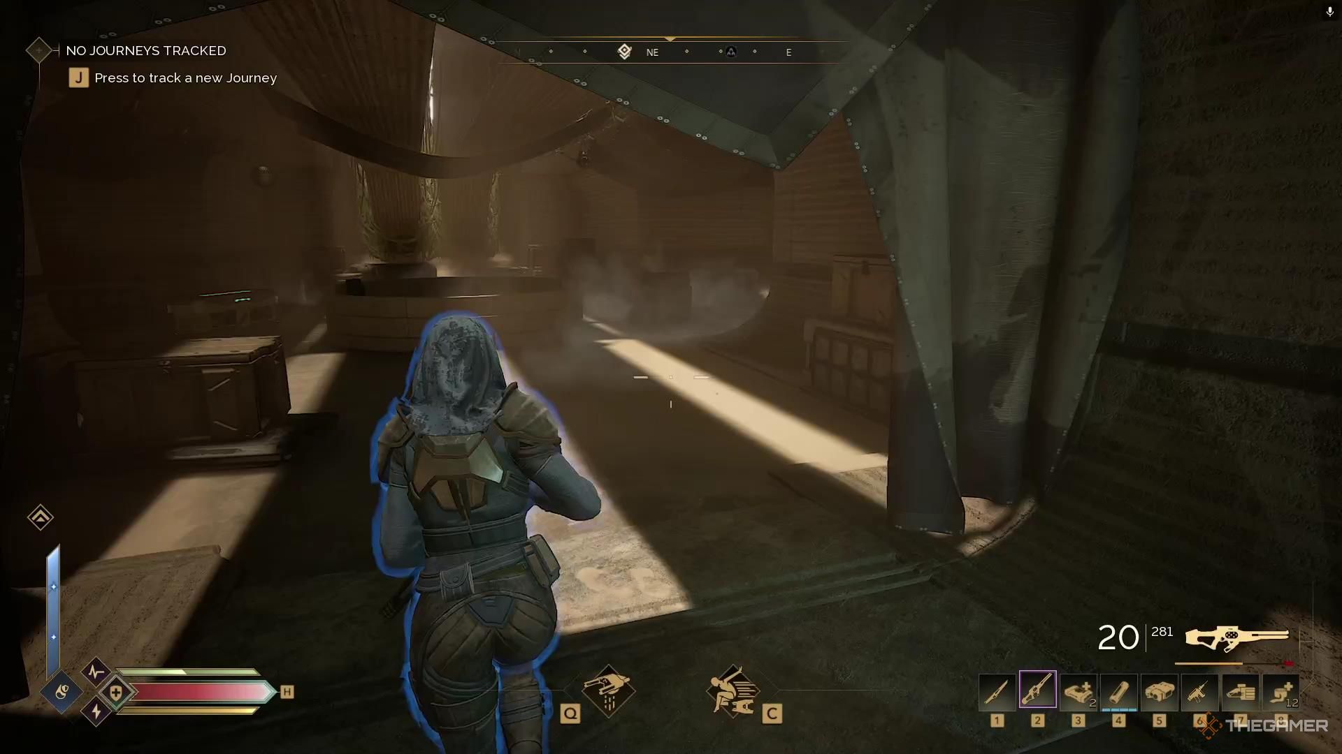 A chest sits in a room near a circular table in Dune Awakening.