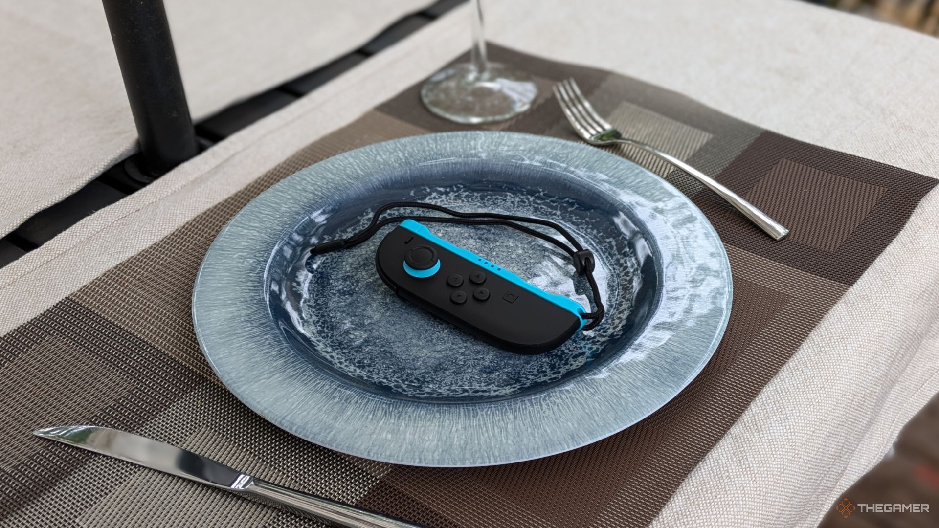 A Nintendo Switch 2 Left Joycon On A Plate.