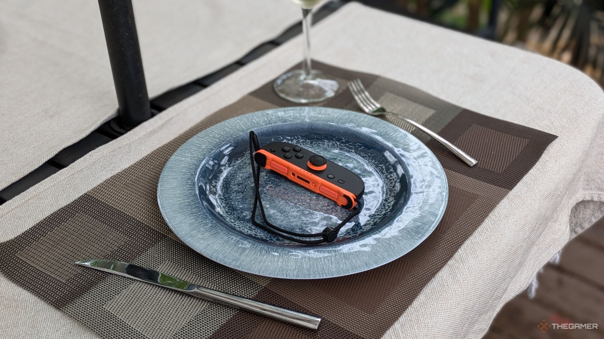 A Nintendo Switch 2 Right Joycon On A Plate.