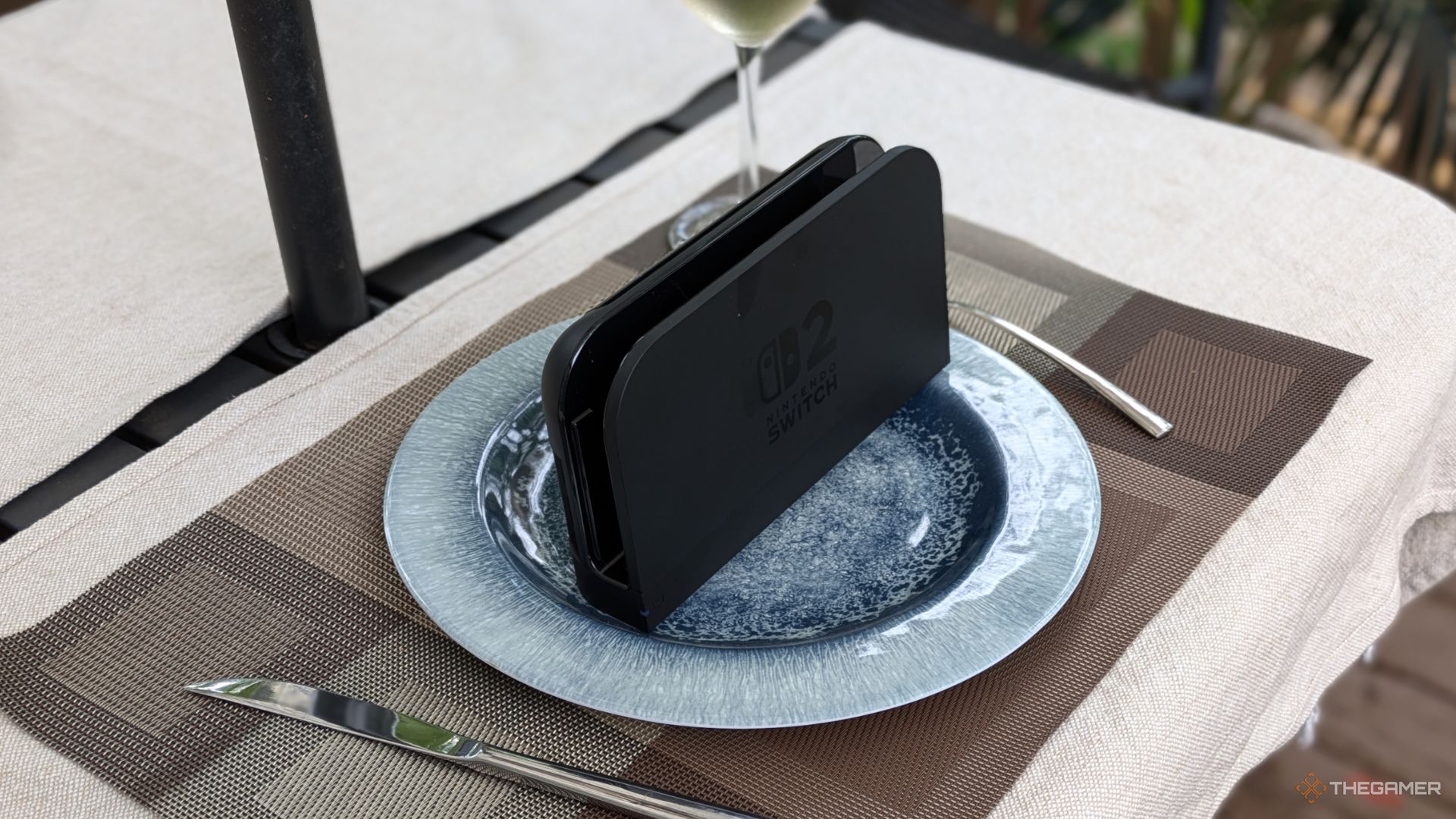 A Nintendo Switch 2 TV Dock On A Plate.