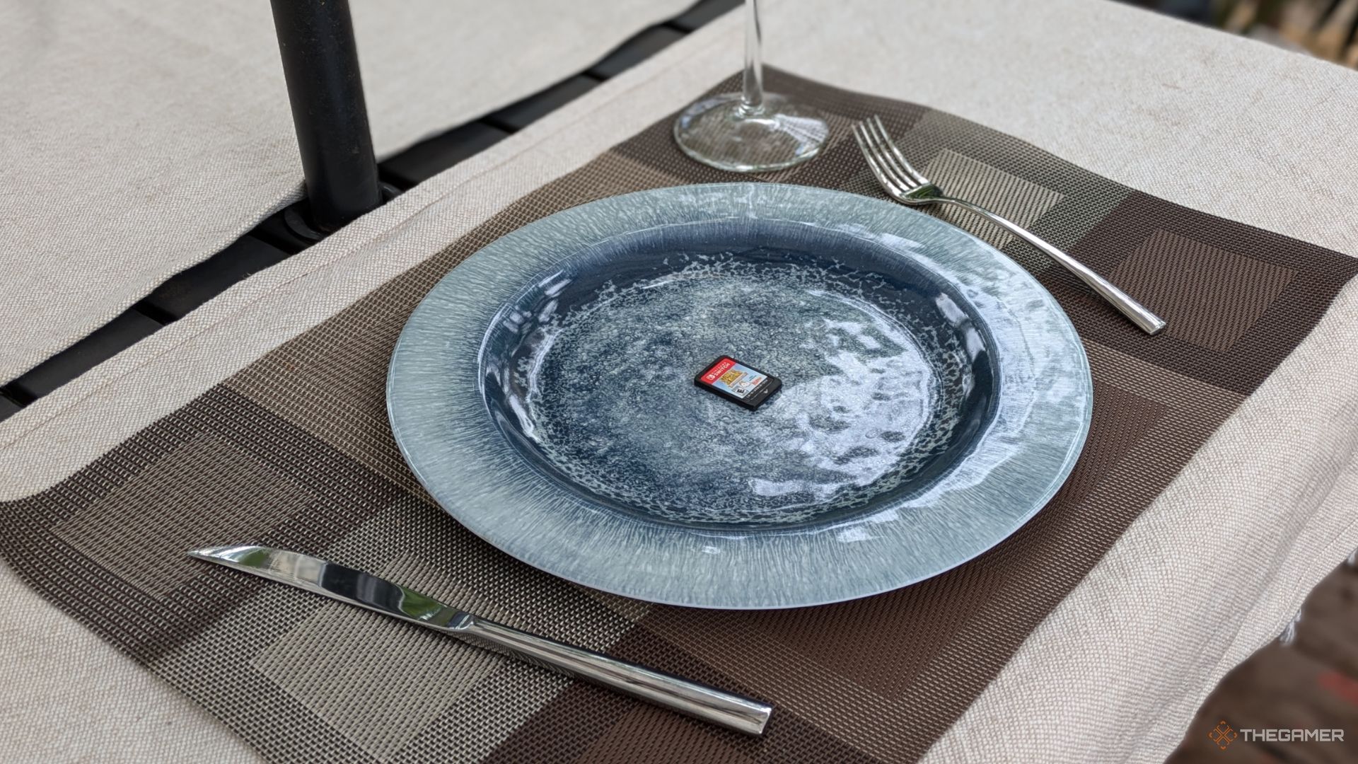 A Nintendo Switch game card On A Plate.