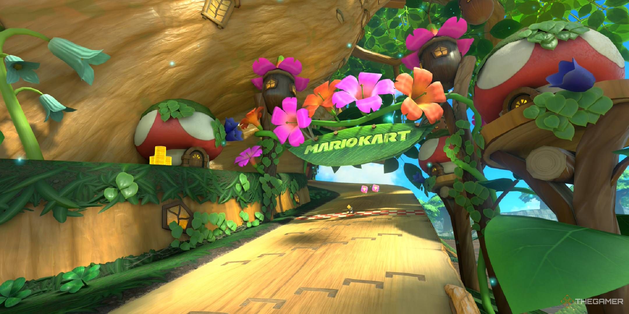 Acorn Heights starting line surrounded with plants, flowers, and a small mushroom house from Mario Kart World.