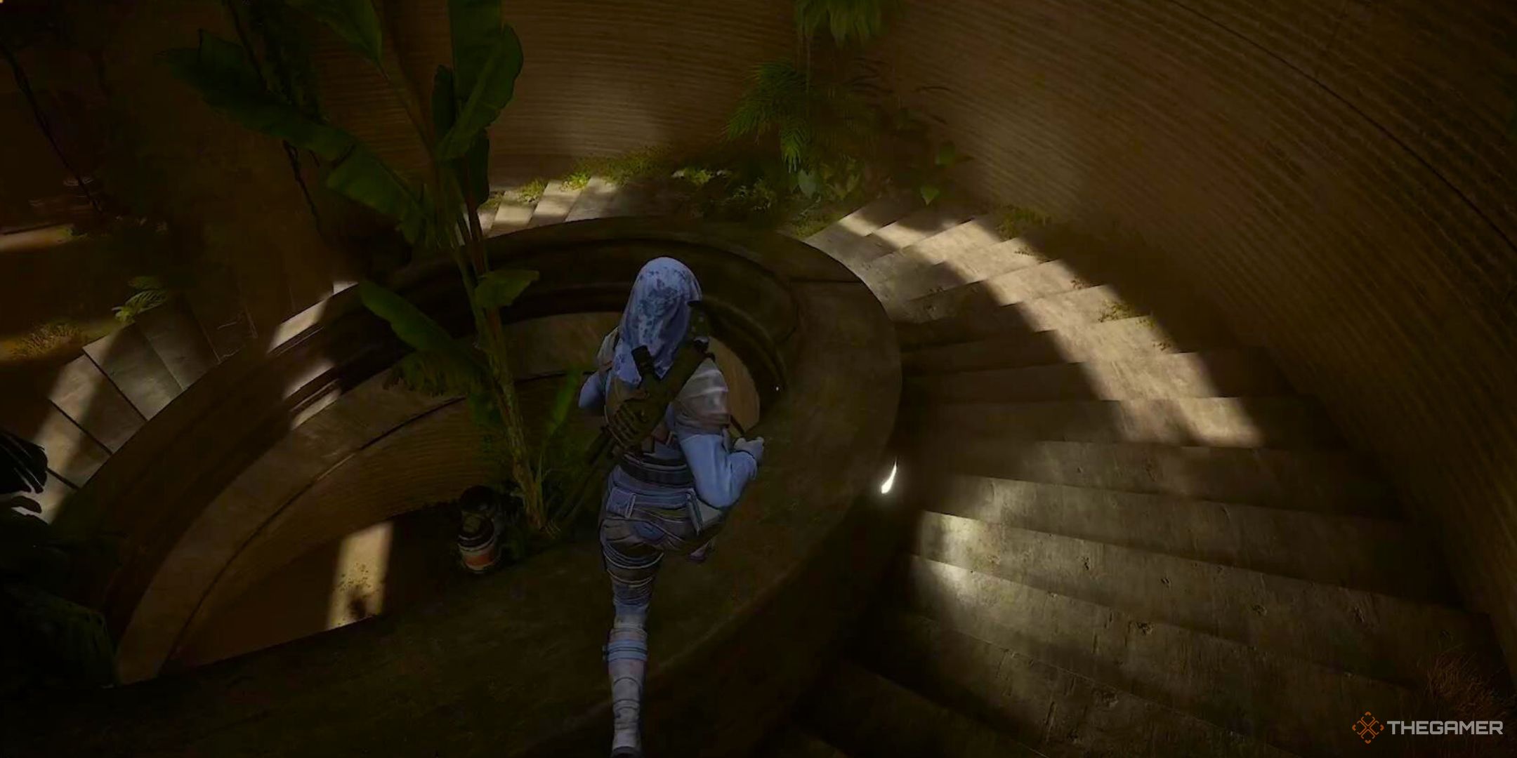 A character goes down a spiral staircase with lush greenery on both sides in Dune Awakening.