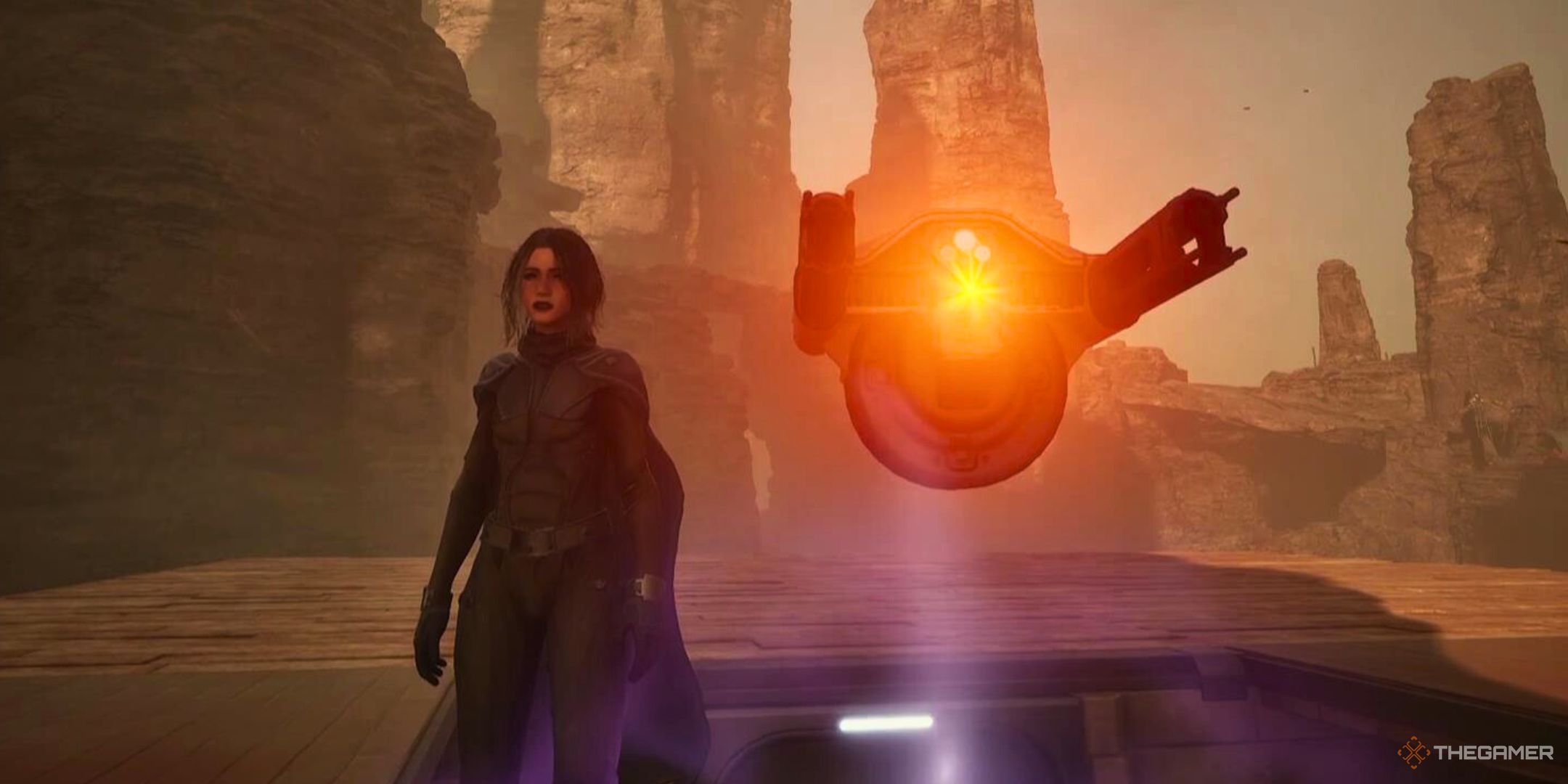 A Mentat stands next to her Sentinel Turret in Dune Awakening.