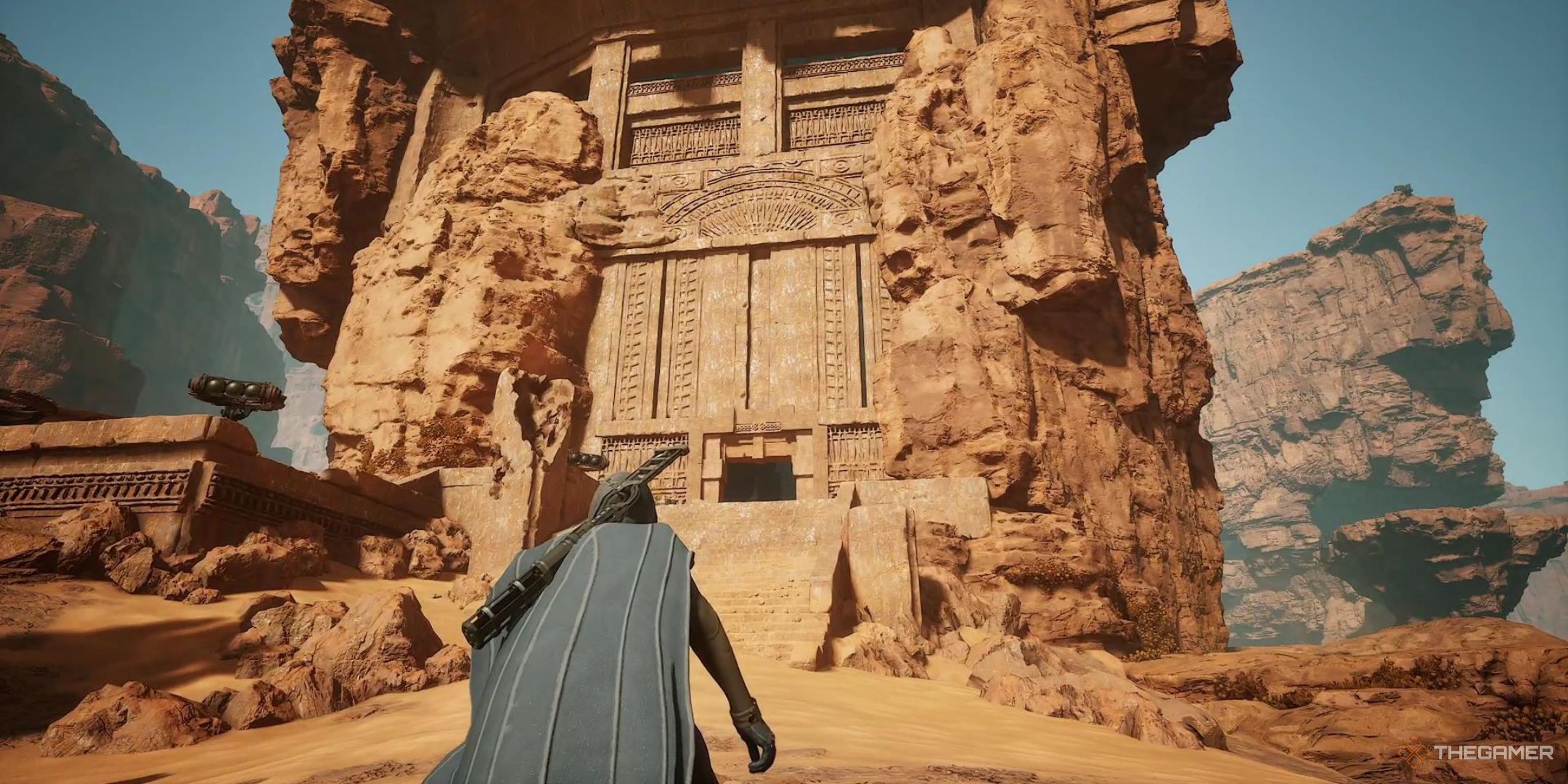 A character crouches in front of Stonestep Valley in Dune Awakening.