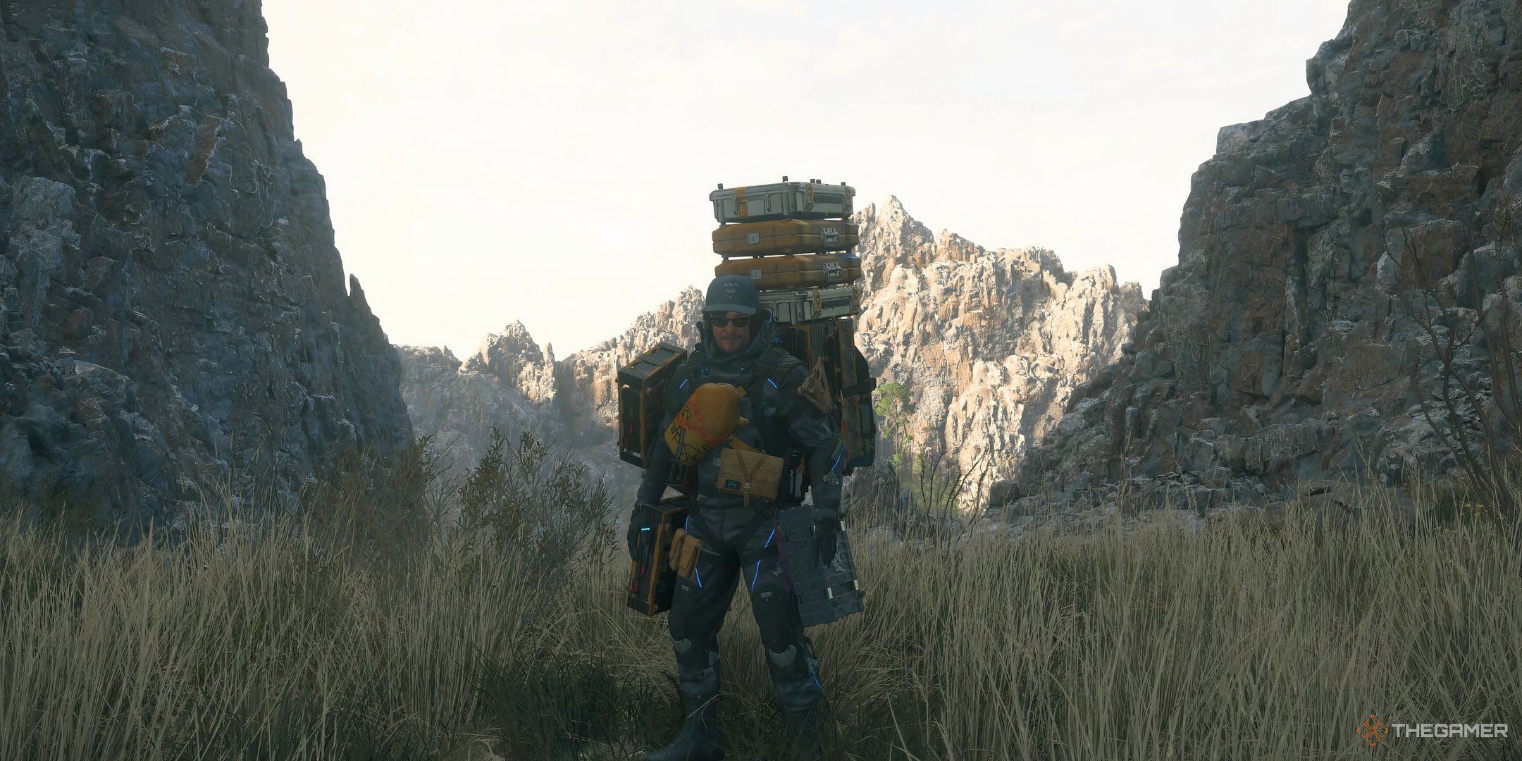 Death Stranding 2 Sam carrying a ton of cargo.