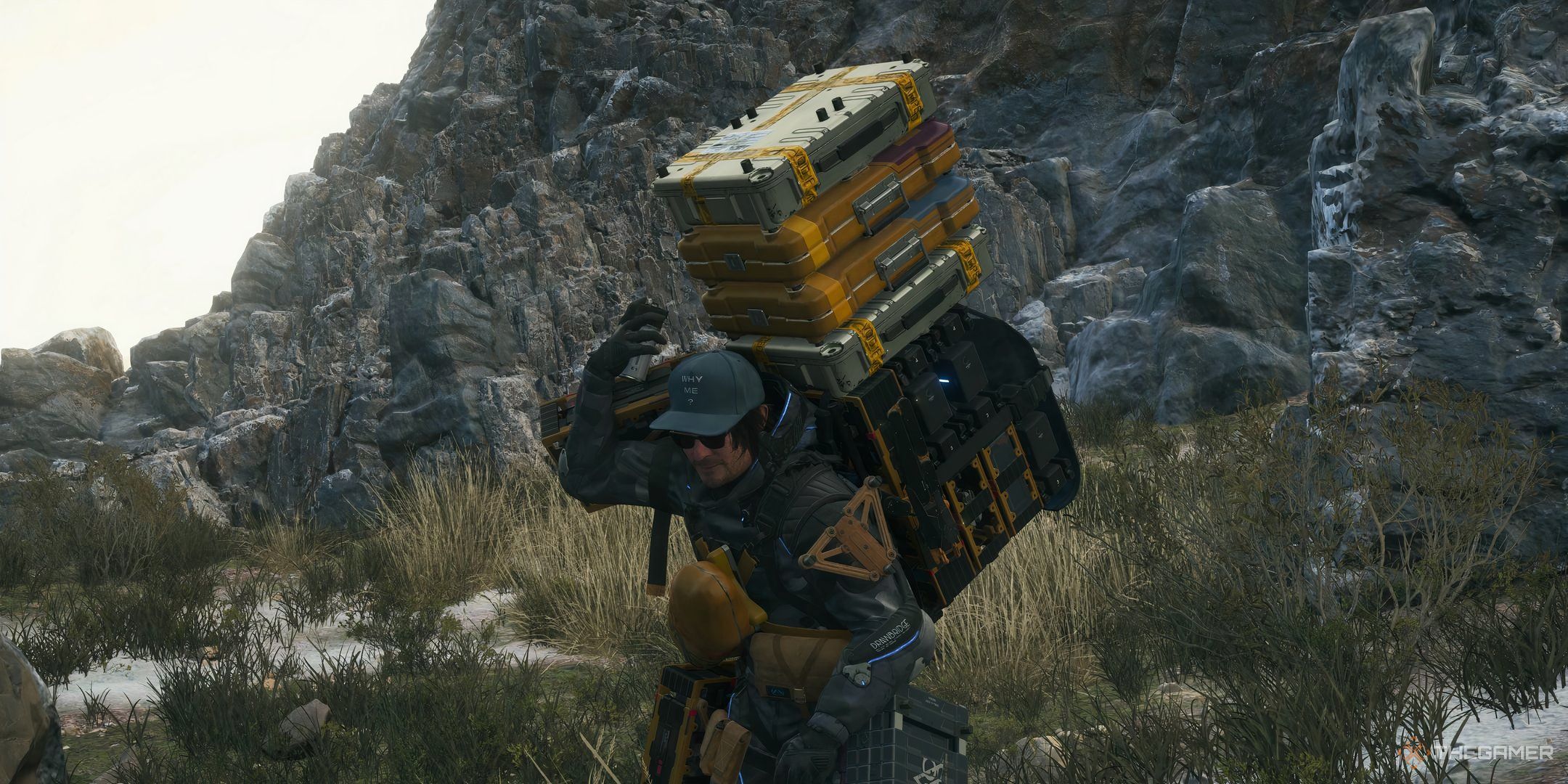 Death Stranding 2 Sam spraying containers to fix them.
