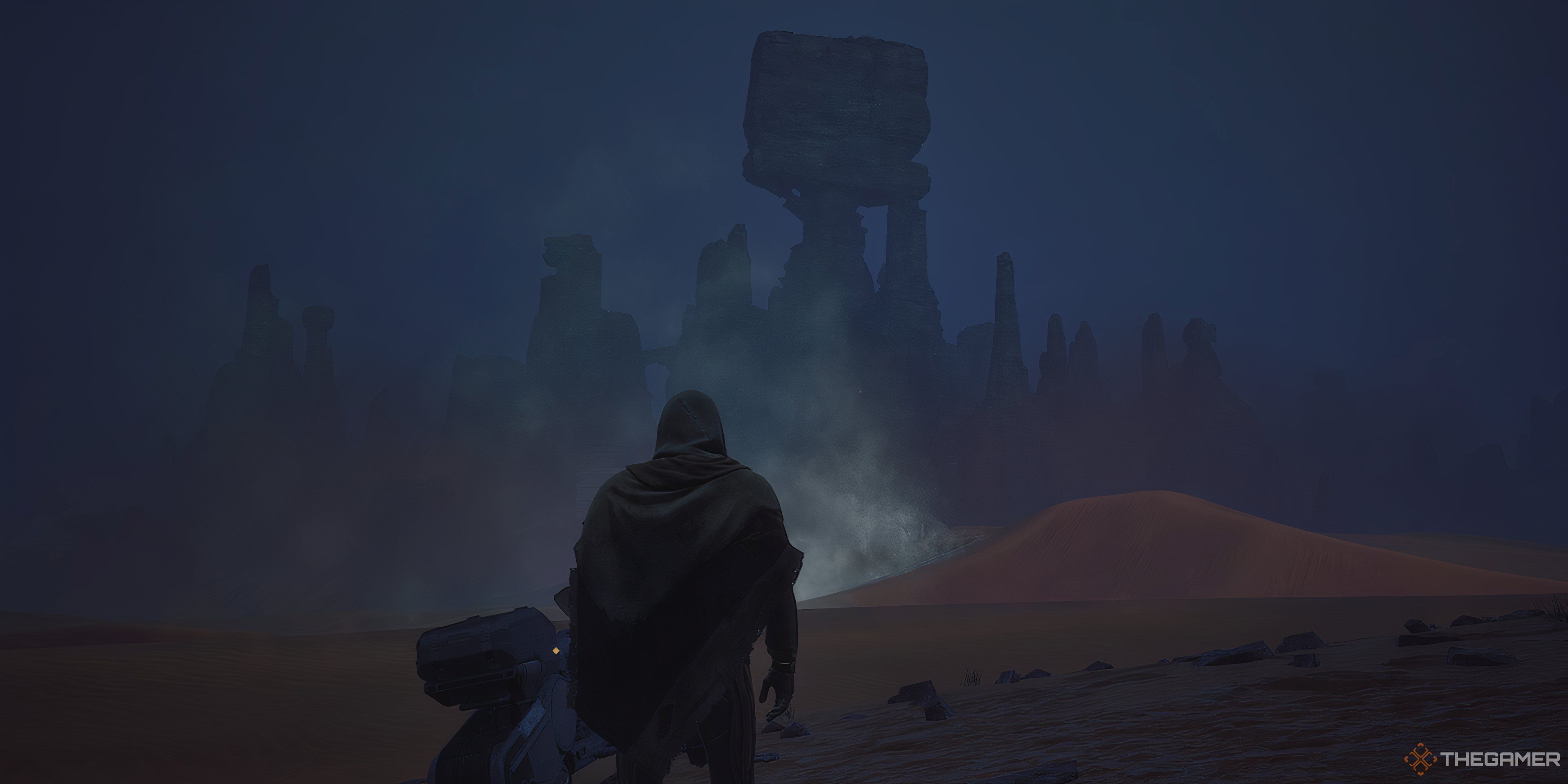 Player standing next to his Sandbike in Dune: Awakening: It is night time and there is a large rock structer with a massive square block at the top in front of the player.