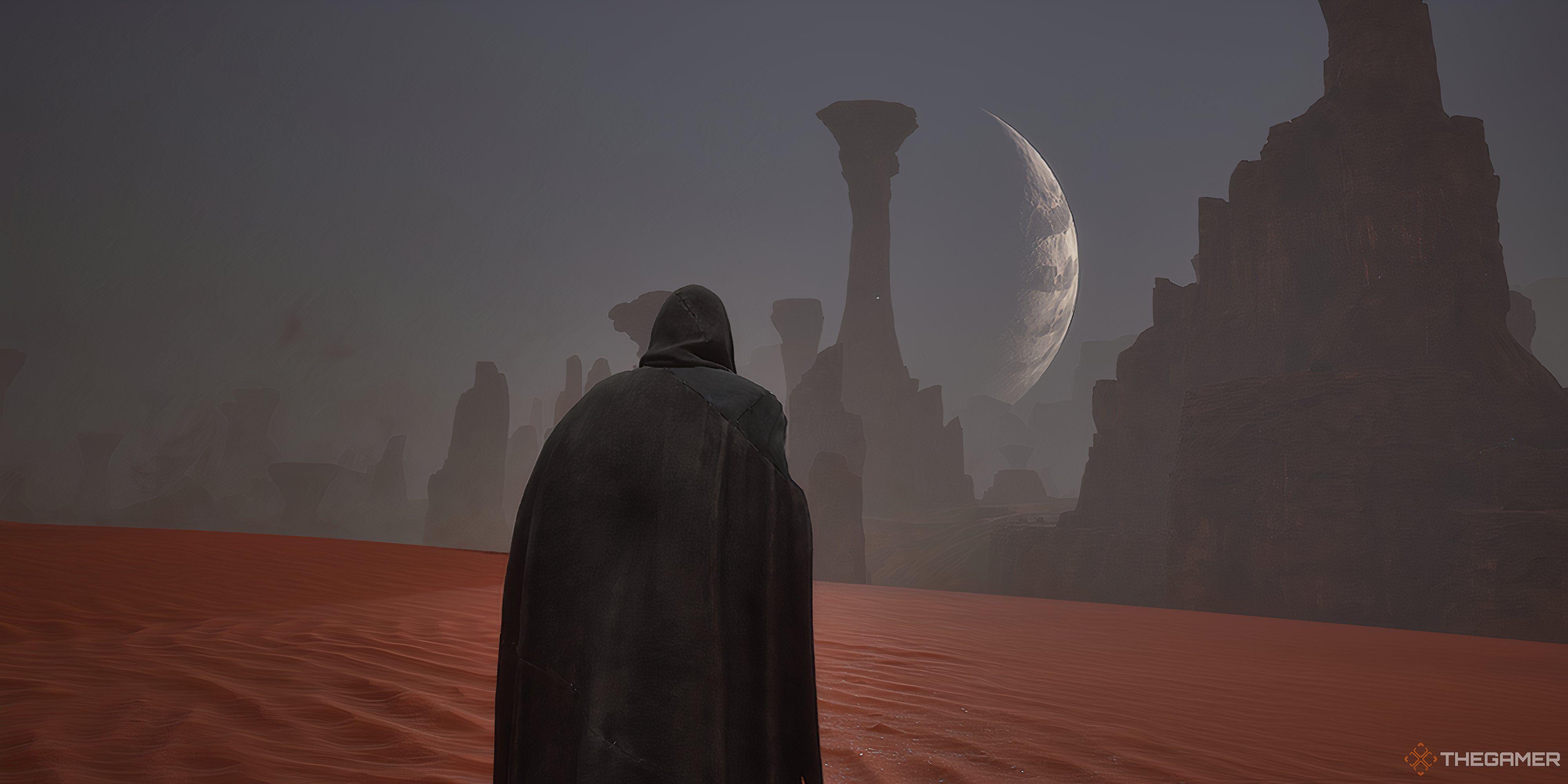 Player looking at a crescent moon with rock pillars in front of it in Dune: Awakening.