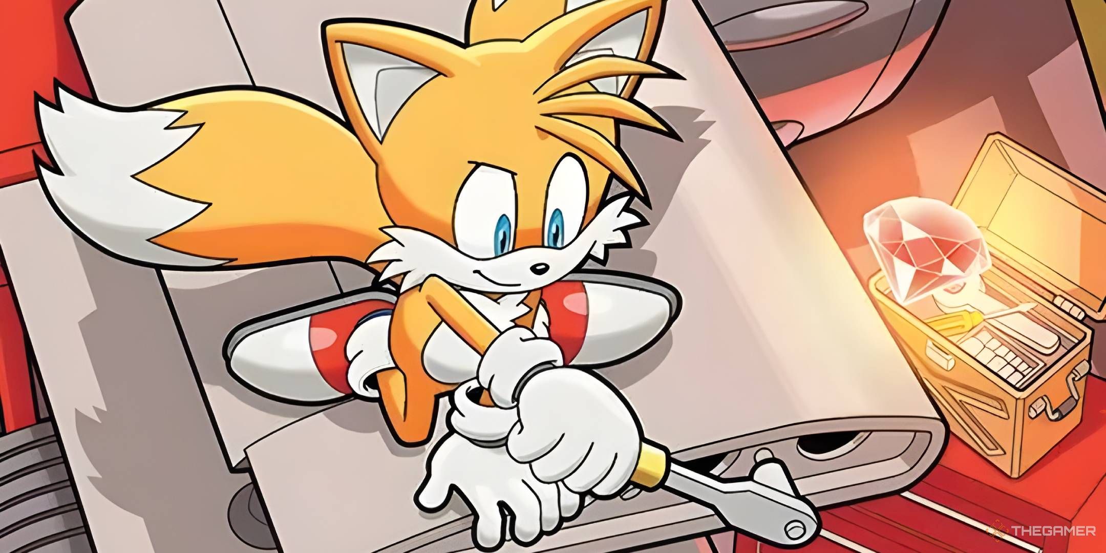 Tails works on the wing of his biplane, while a Chaos Emerald sits in his toolbox nearby.