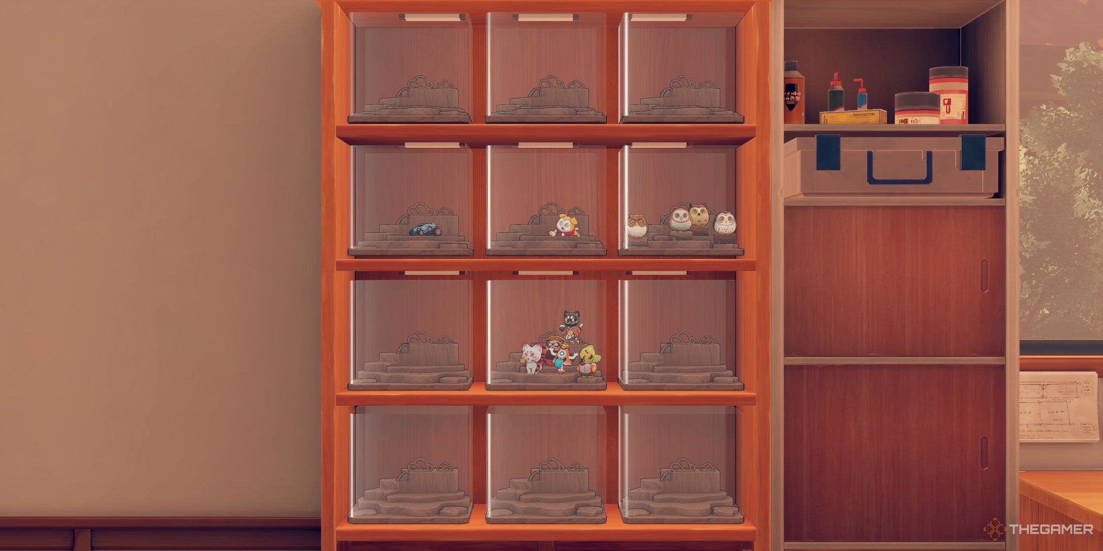 View of a wooden display cabinet filled with display sets and several have small figures in them in Persona 5: The Phantom X.