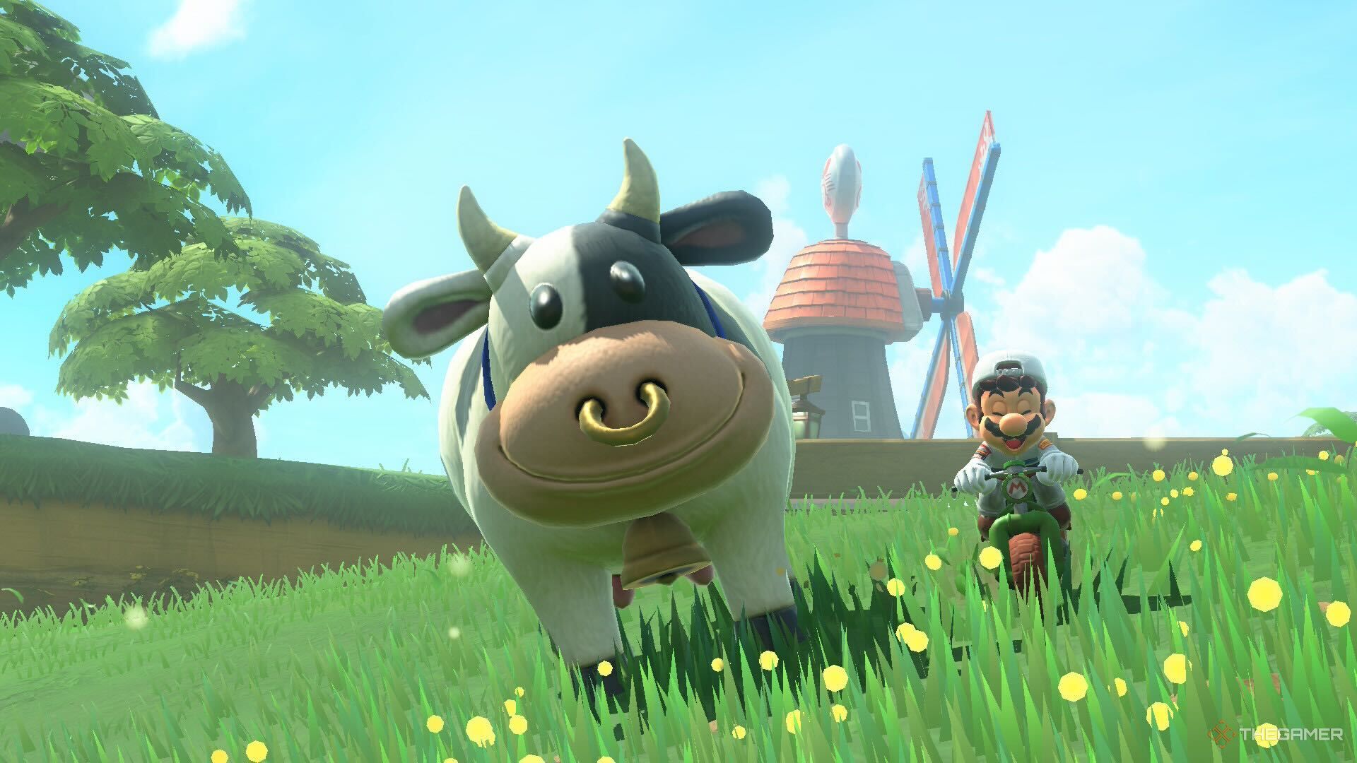 Mechanic Mario sitting next to a Moo Moo Meadows cow in Mario Kart World.