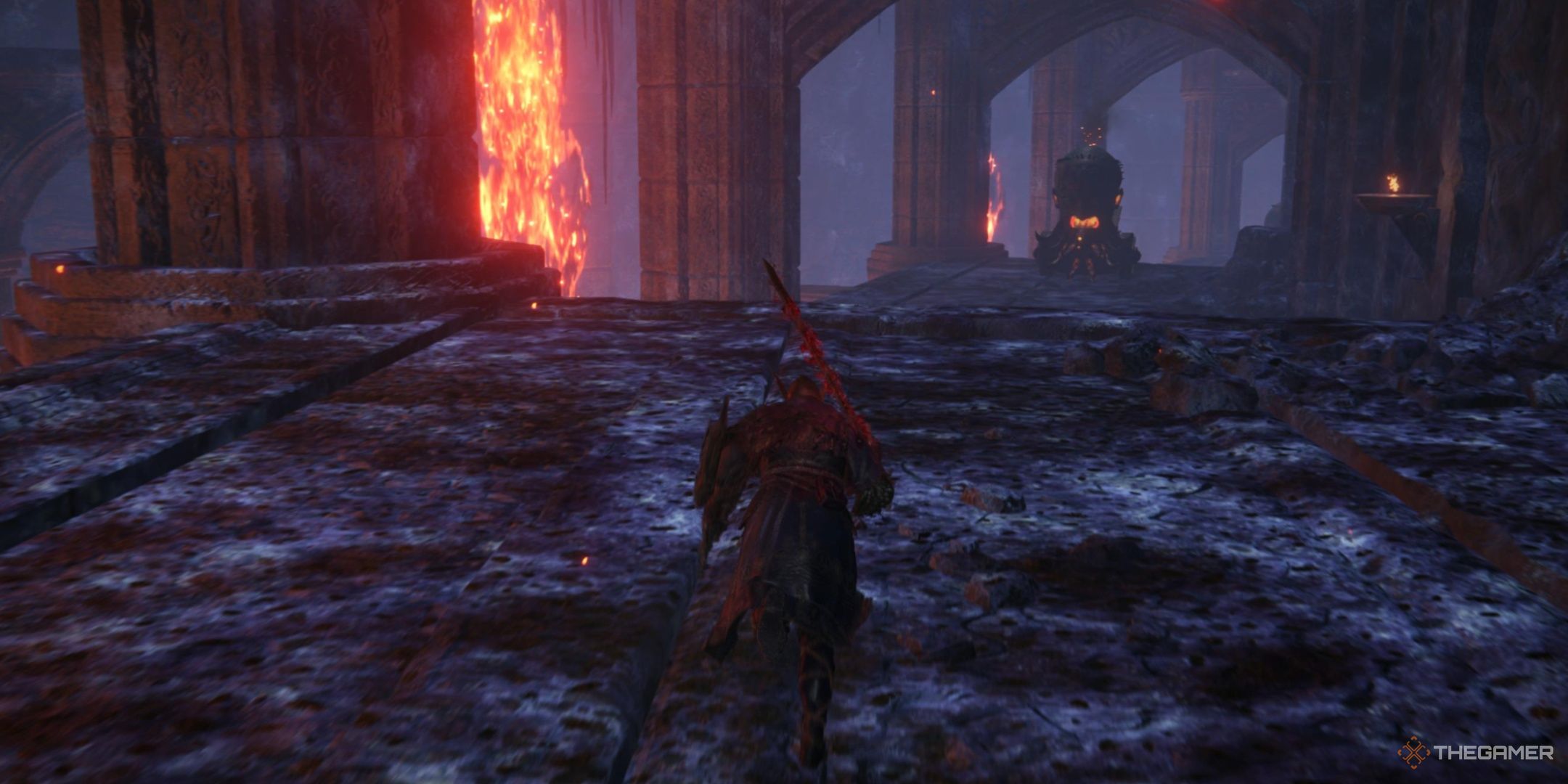 Wylder running towards a flame chariot in the crater in elden ring nightreign.