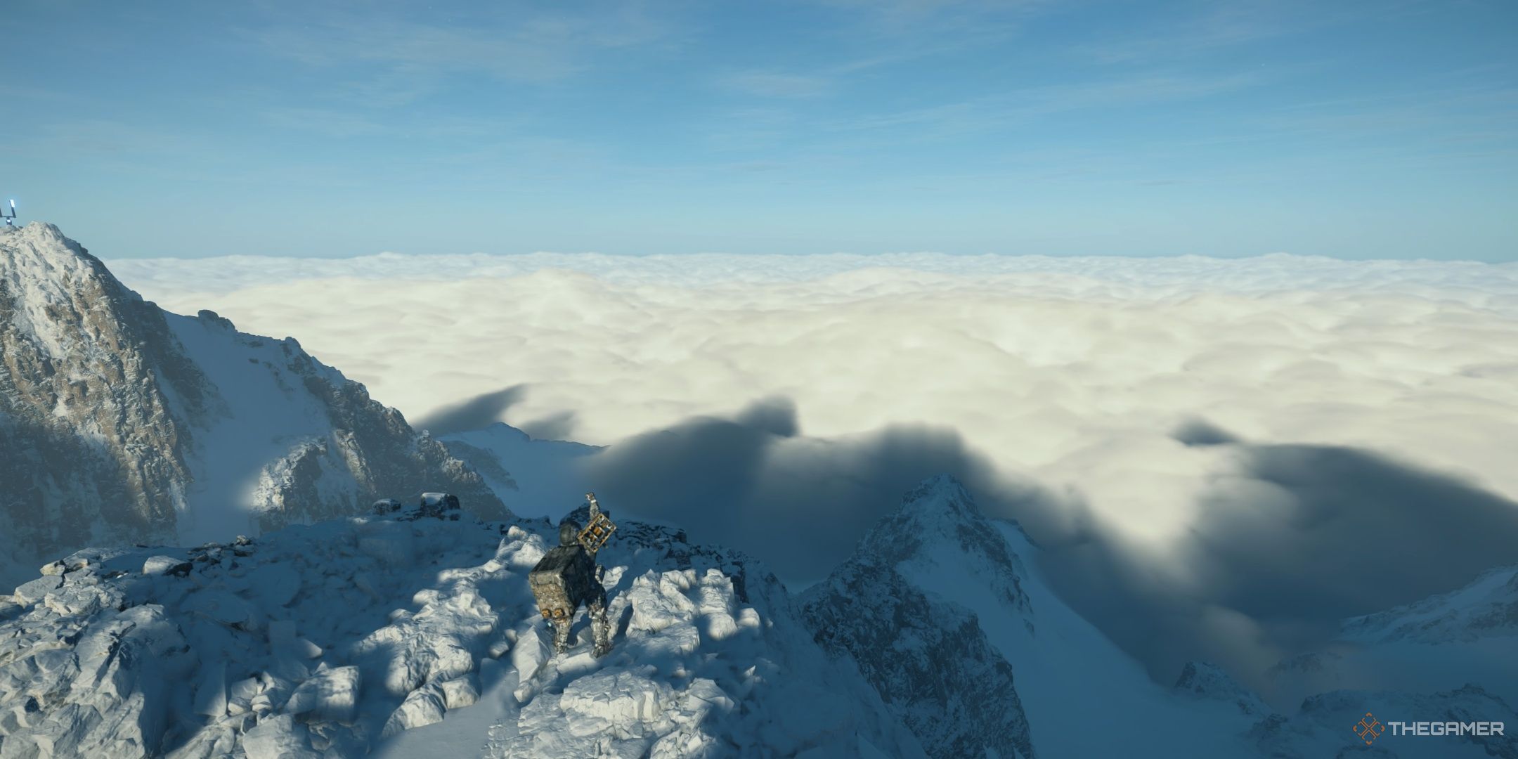 Sam stands atop a snowy mountain in Death Stranding 2. 