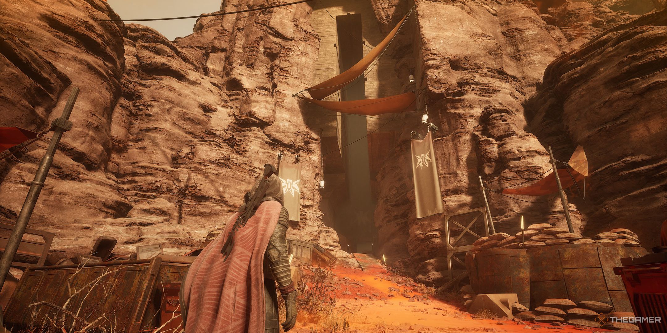 The player standing in front of an Imperial Testing Station in Dune: Awakening.