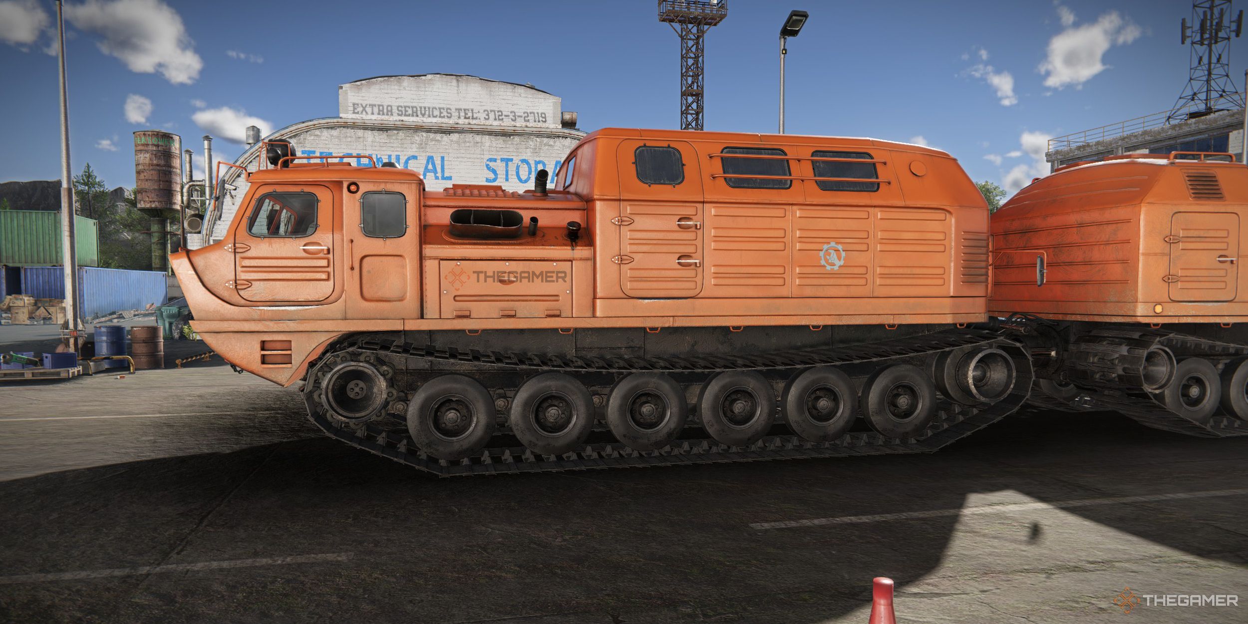 RoadCraft orange tracked vehicle with TheGamer logo on it.