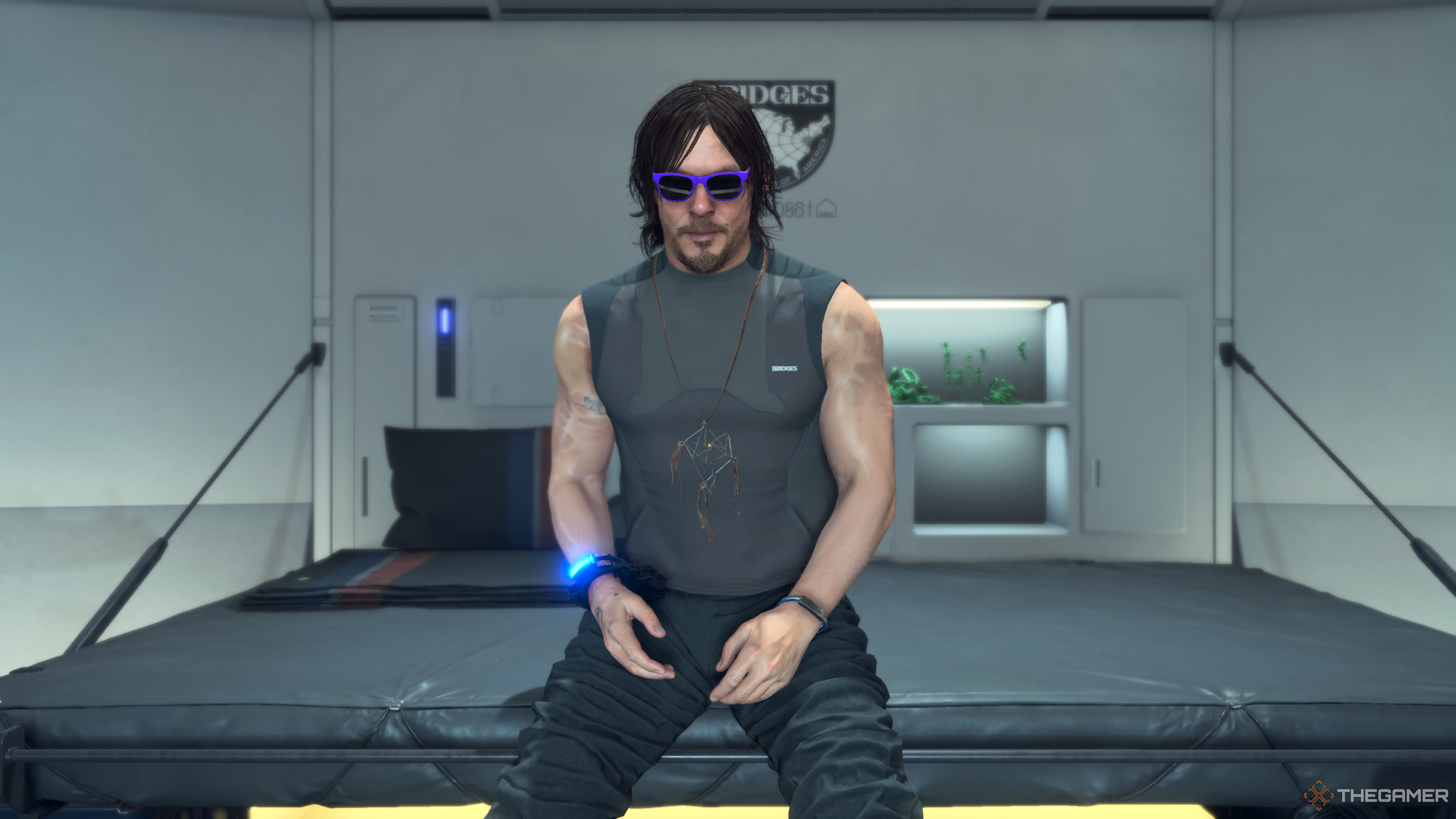 Sam Porter Bridges in his room wearing purple sunglasses in Death Stranding