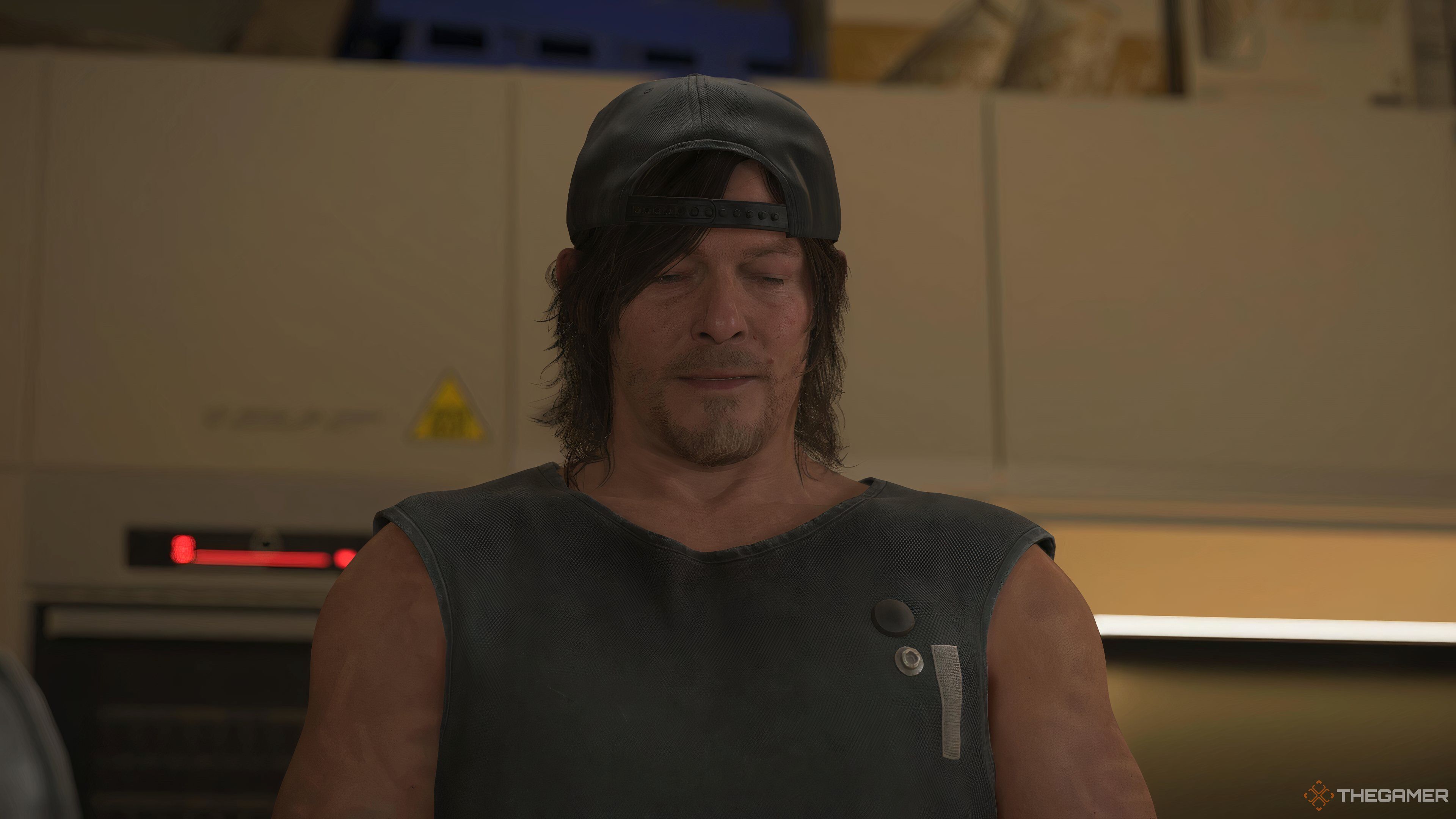 Sam Porter Bridges looking sad in Death Stranding 2: On the Beach.