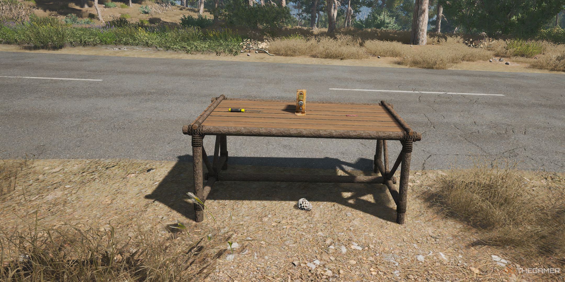 Scum table with a lockpicking board and various items required for lockpicking.