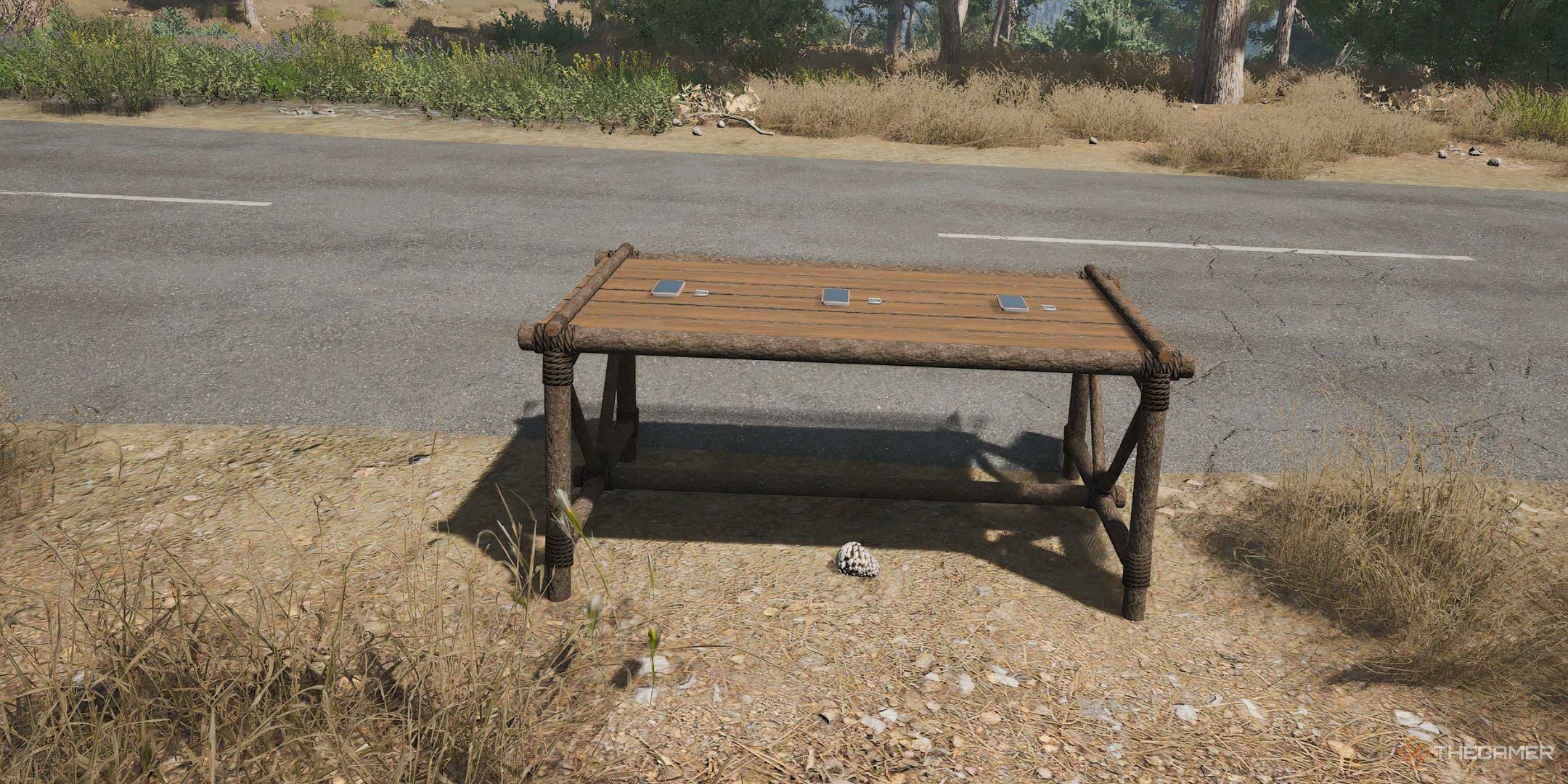 Scum table with three smartphones and their batteries.