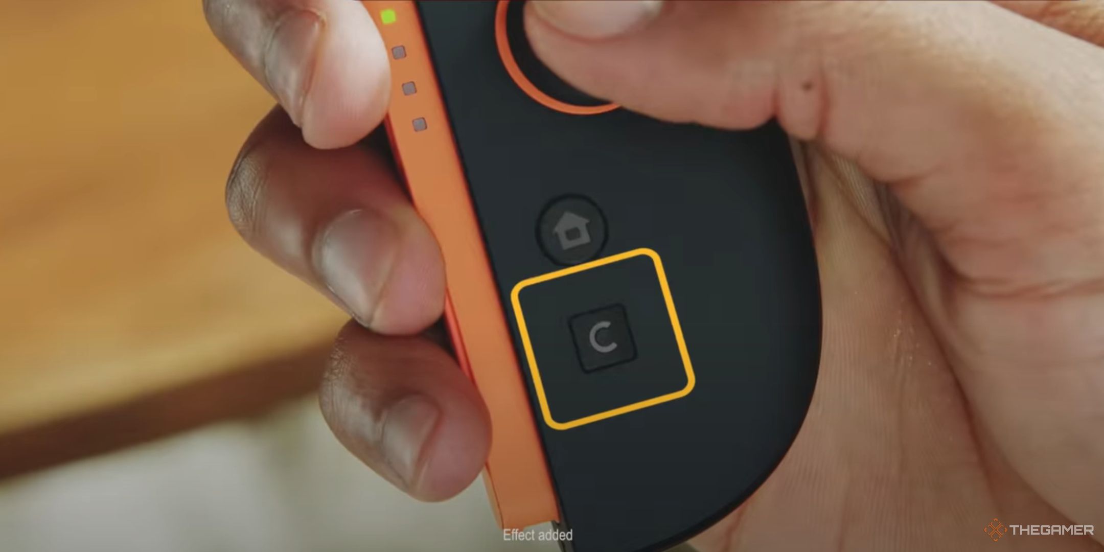 The GameChat button highlighted on the Joy-Con 2.