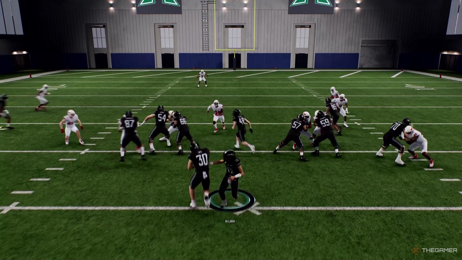 A running back takes a handoff in College Football 26.