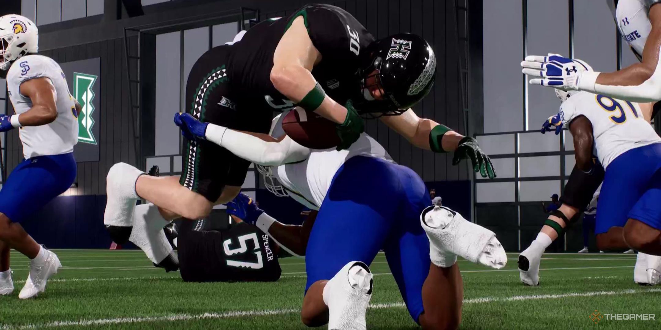 A linebacker tackles a running back in College Football 26.