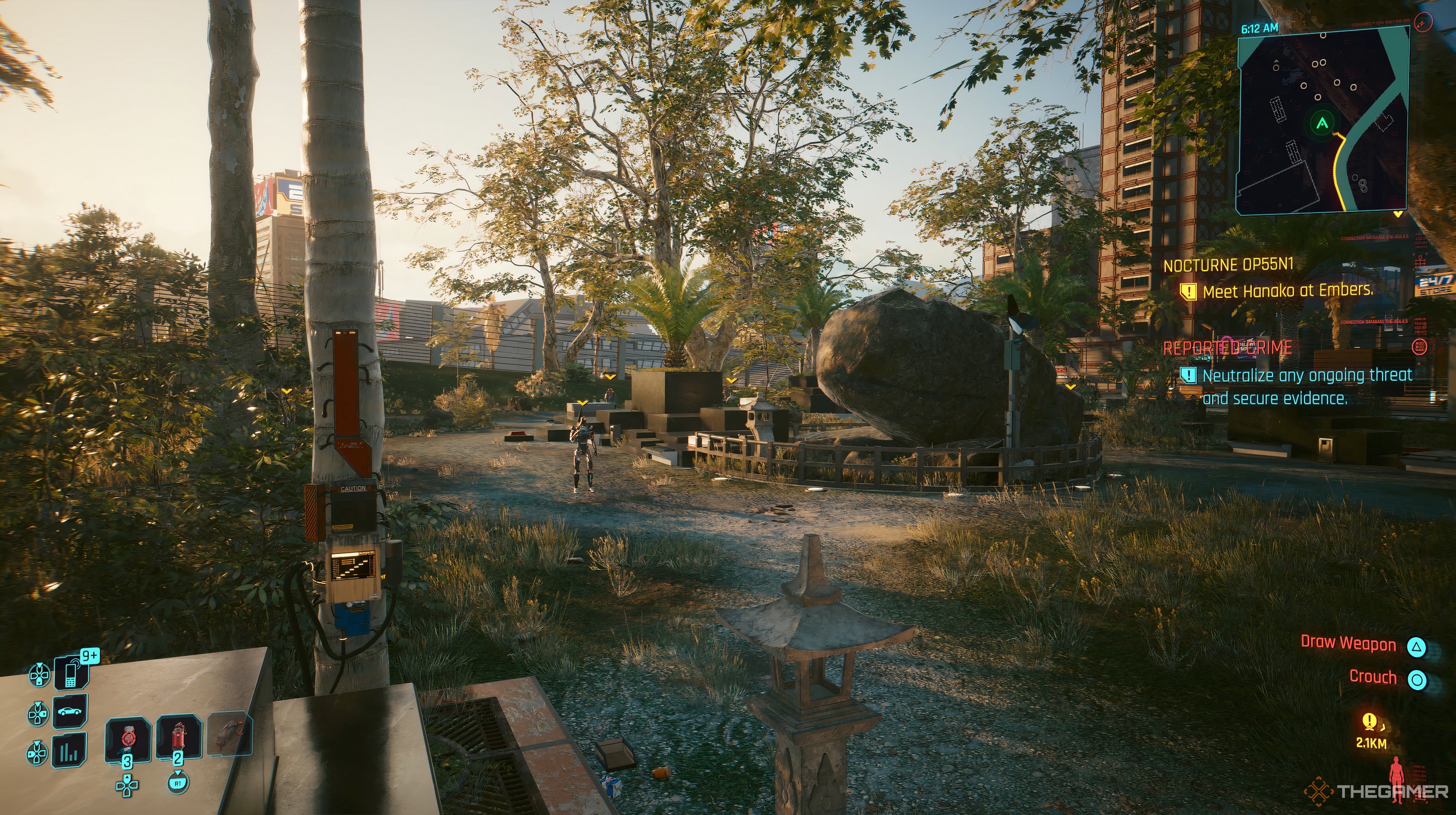 Player in the court yard looking at a few enemies in Cyberpunk 2077. There is a large rock in front of them.