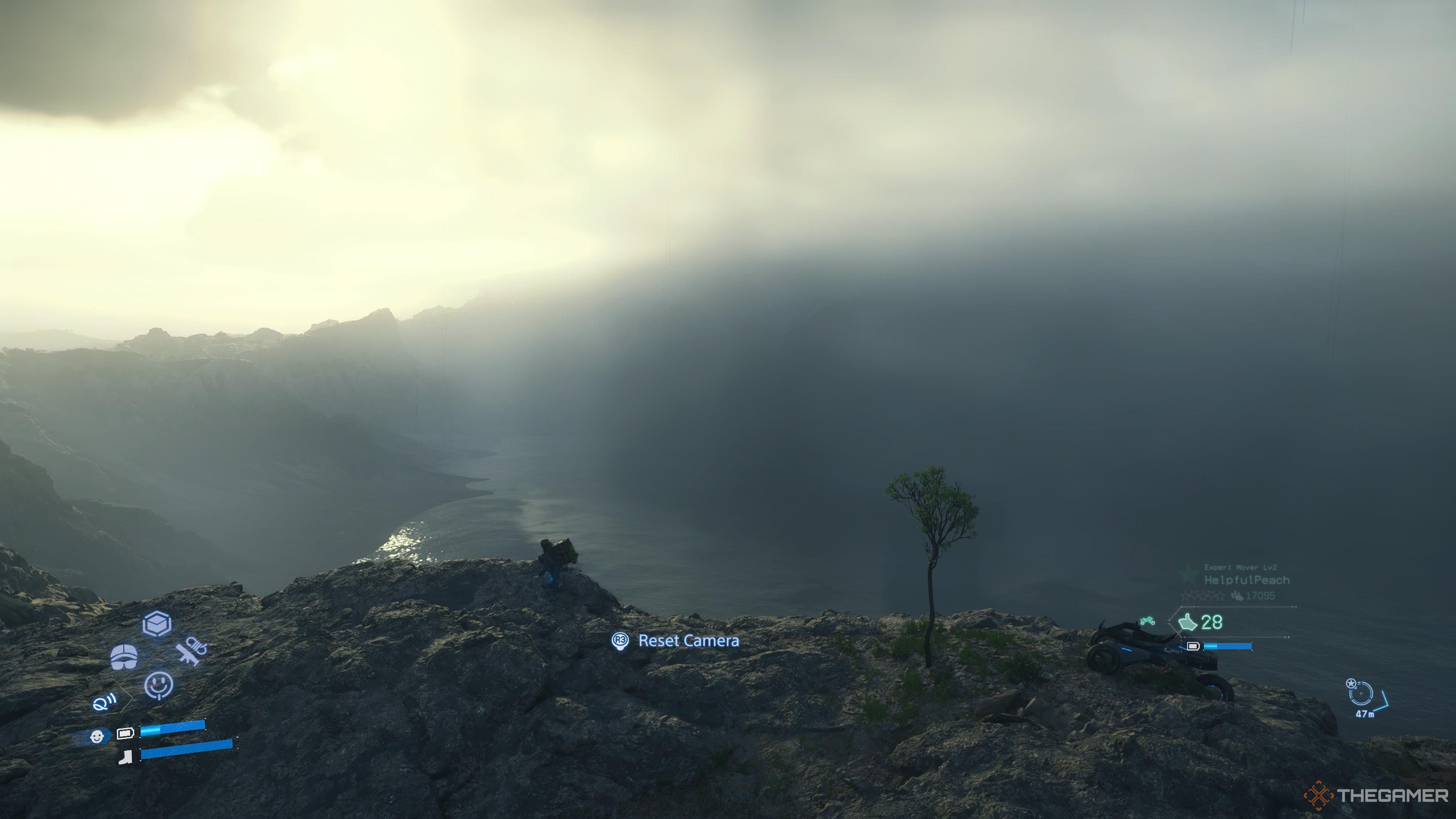 Sam looking towards the massive tar lake in death stranding 2 on the beach.